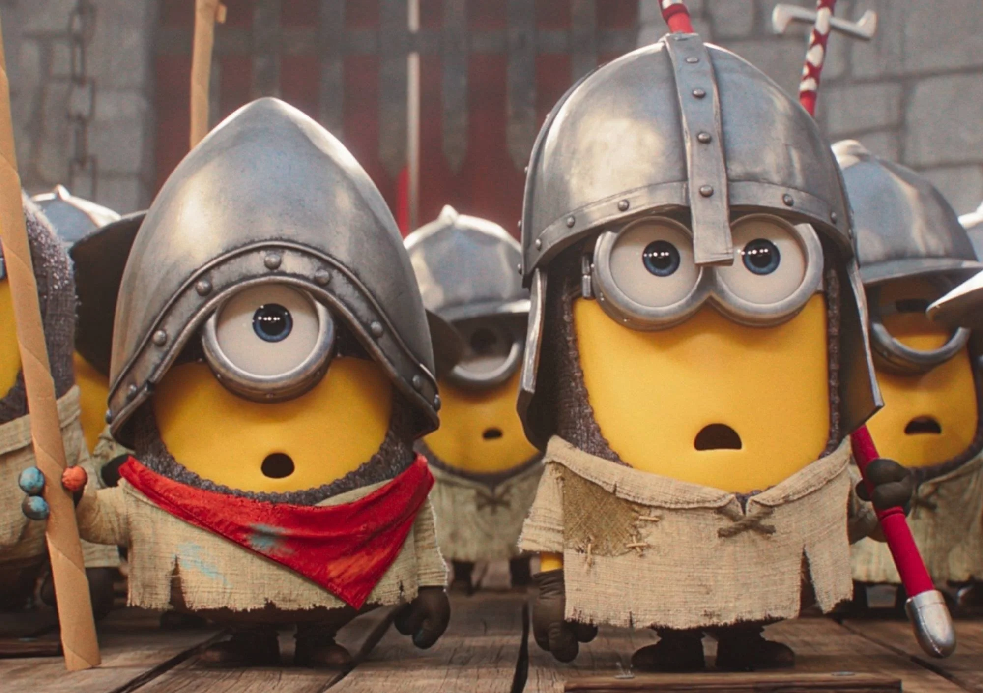animated one eyed minions and two eyed minions stand in knights outfits