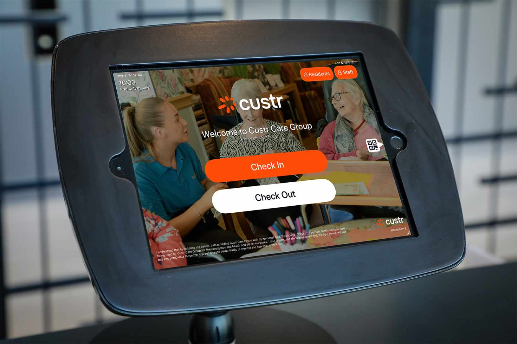 A Custr visitor check-in system for care groups in a black bounce stand