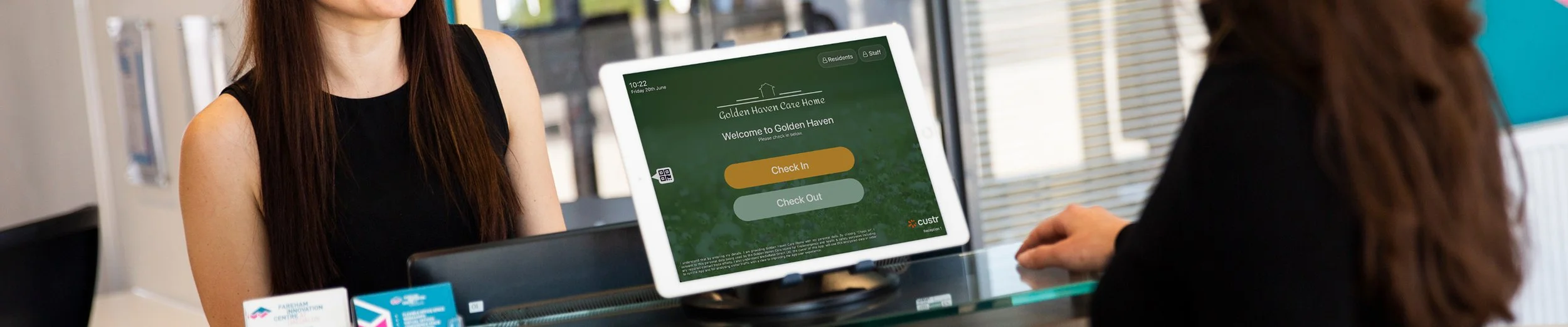 Golden Haven Care Home branded iPad at a reception