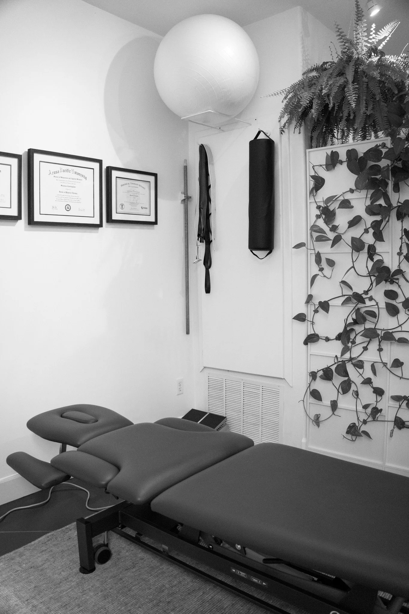 Physical therapy treatment bed inside a clinic treatment room in Summerland Physical Therapy & Wellness