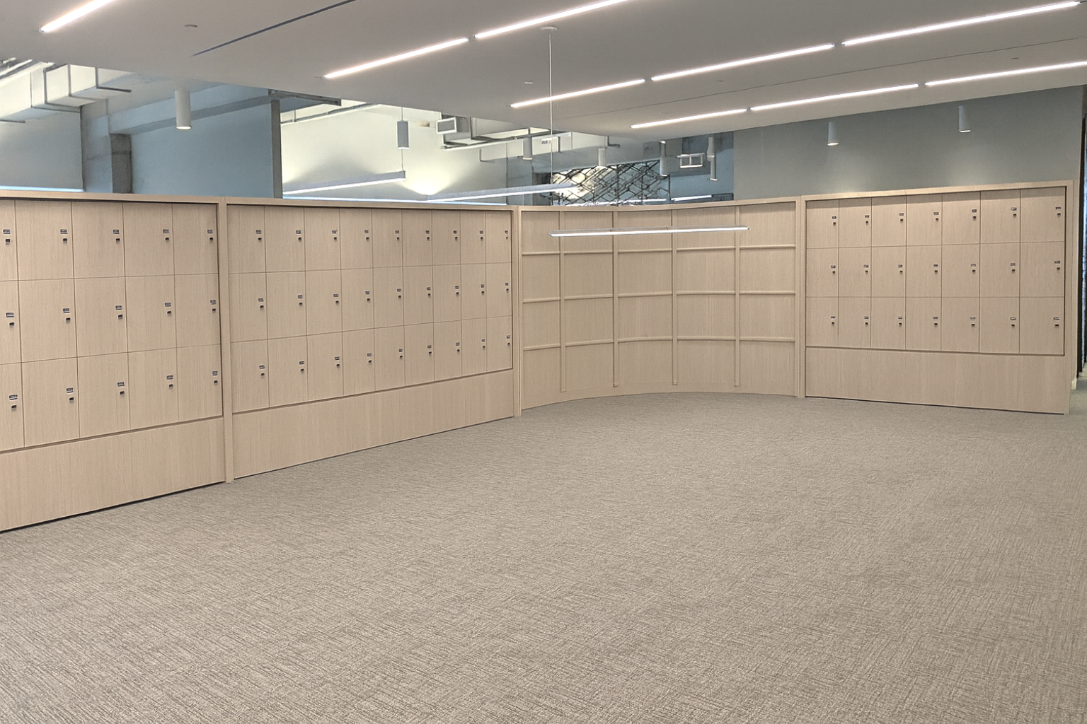 Empty white and blue metal shelving unit in an office or store, with a lockable cabinet door on the right, and a lock on the right-side panel.