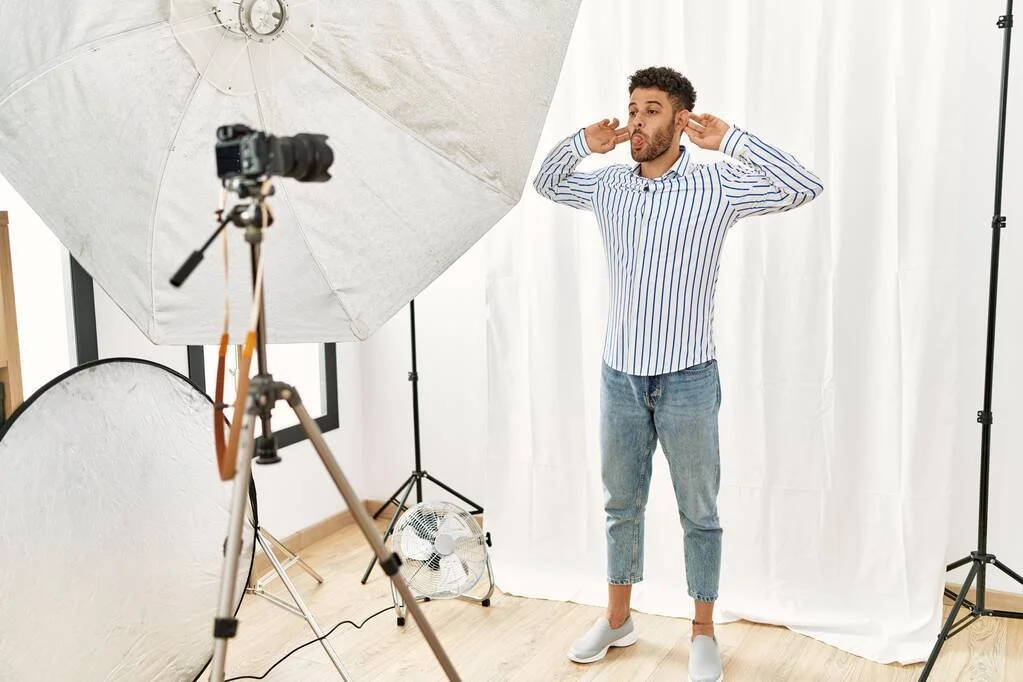 stock-photo-arab-young-man-posing-model-photography-studio-smiling-pulling-ears.jpg