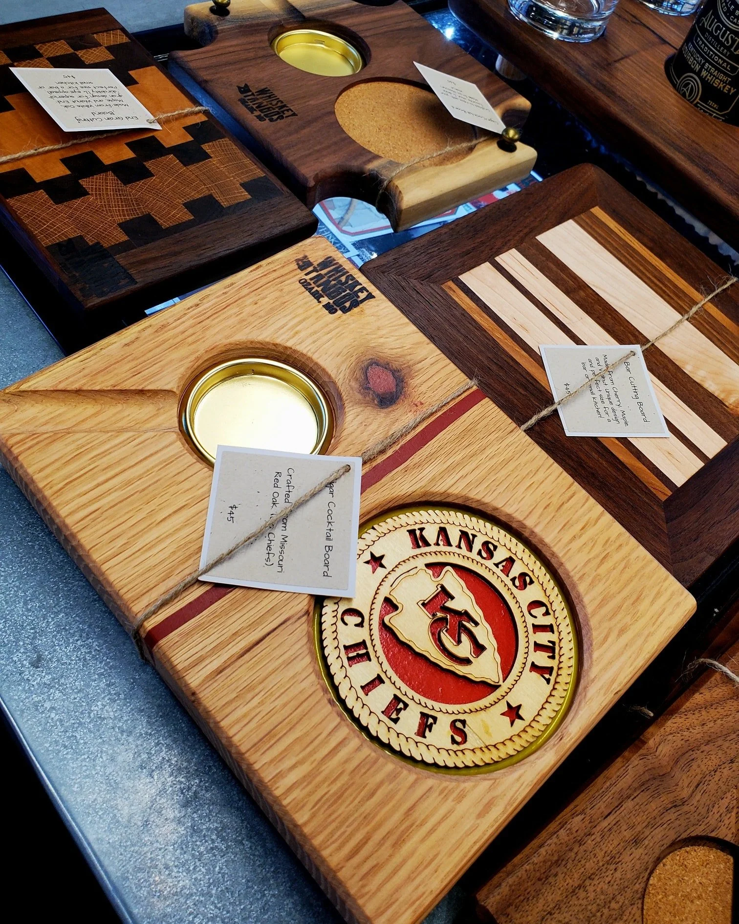 Local hand made cigar/cocktail boards, cutting boards, and bottle/glass display boards in store every day. Get something cool to spruce up your experience!