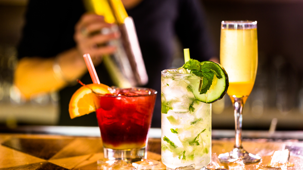 three cocktails in a bar