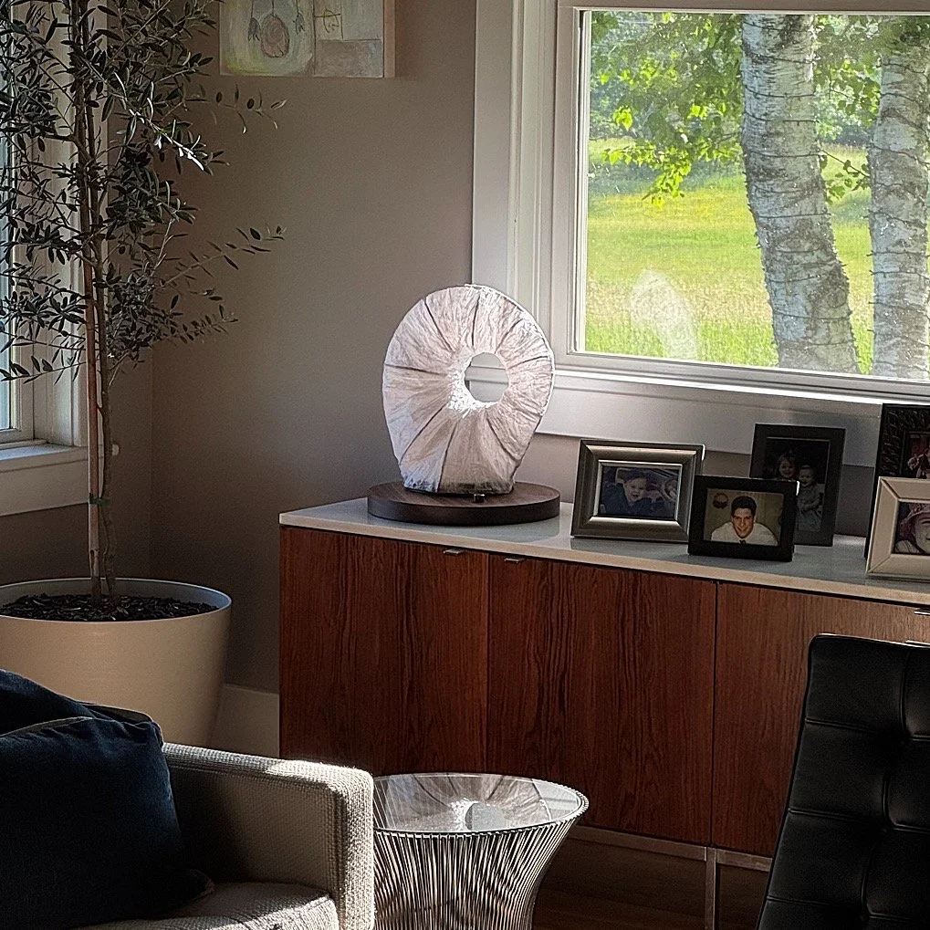 The Chrysalis Paper Shade Lamp is stunning whether on or off. The hand-crafted shades are one-of-a-kind, made from thick paper hardened over a rigid wire frame. Inside is a fully dimmable LED light strip. Available in Walnut or Sapele. Learn more and