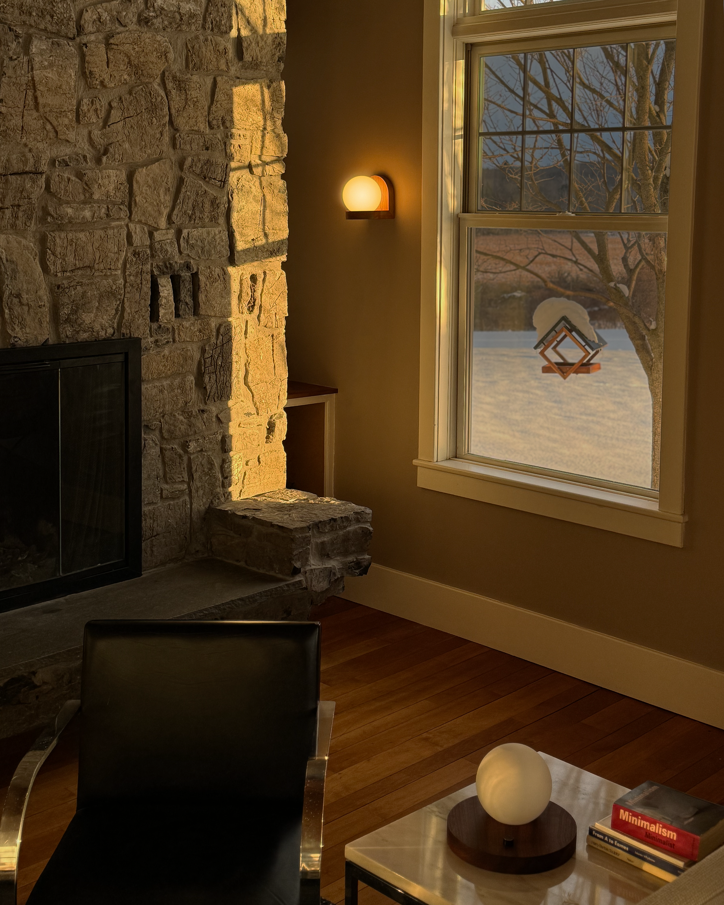 Modern, minimal wall sconce, made from solid cherry hardwood.