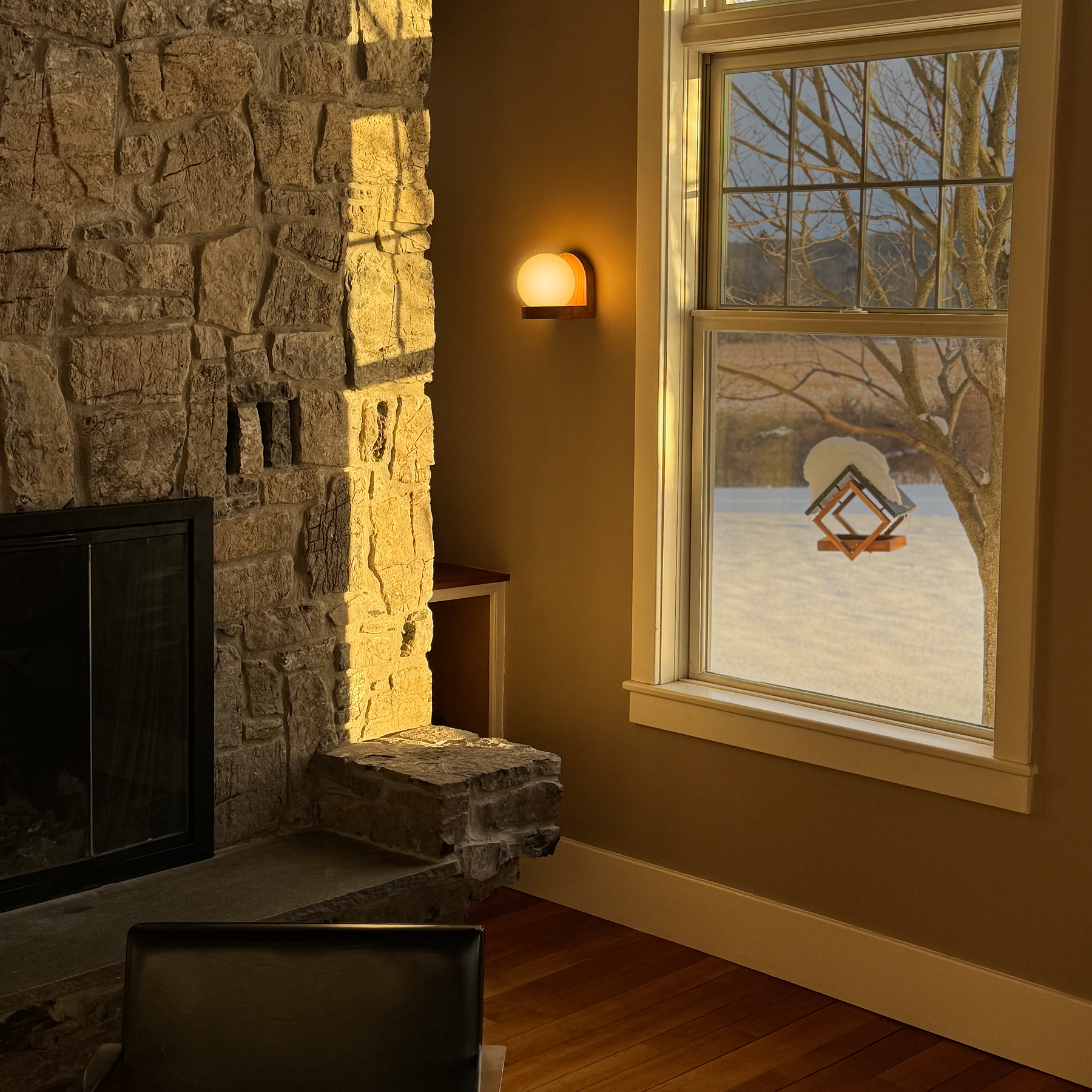 Modern, minimal wall sconce, made from solid cherry hardwood.