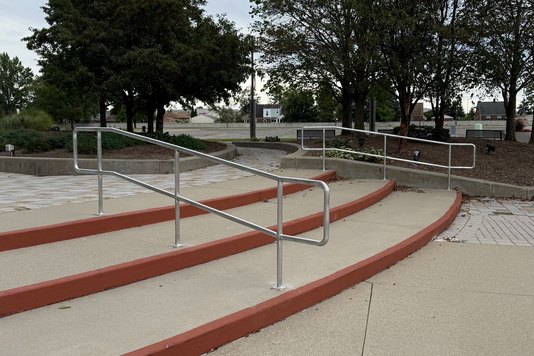 Custom commercial access ramp with steel pipe guardrails