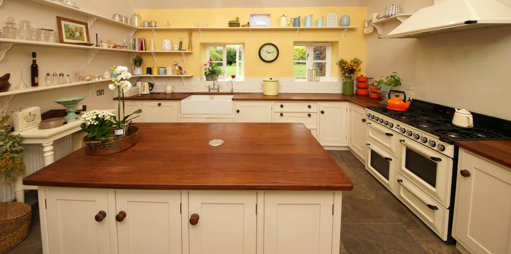 Rutland Vermont Real Estate-Kitchen with yellow wall, shelves, and island.png