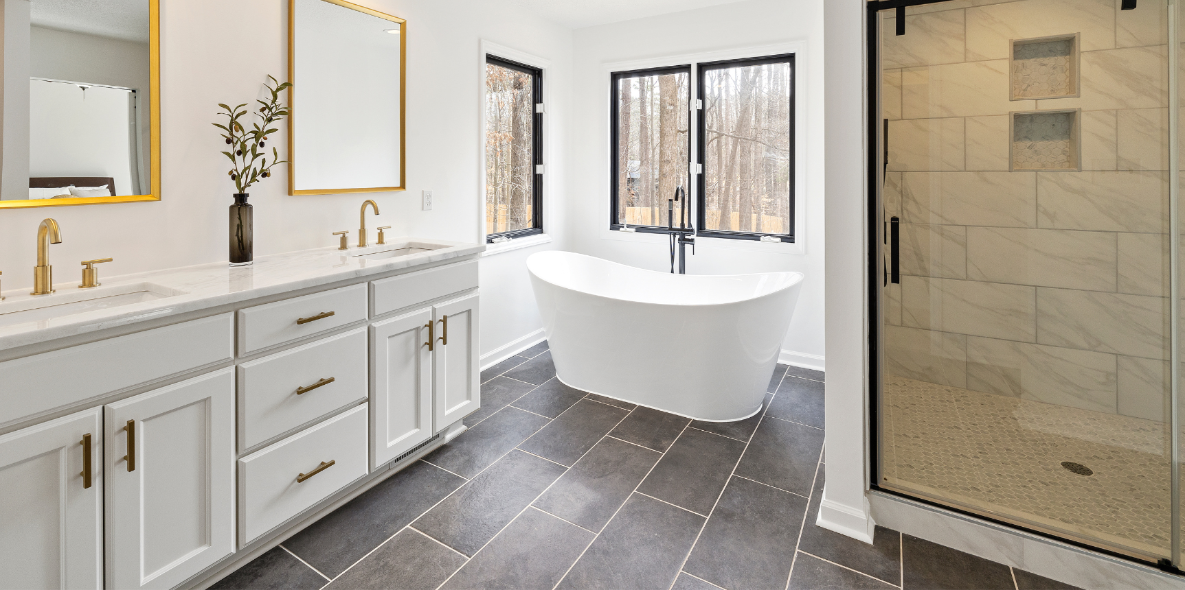Rutland Vermont Real Estate-bathroom with tub, standup shower, double sink, white cabinets.png