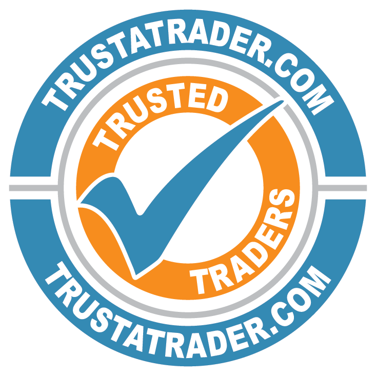 A circular logo with the words "TrustTrader.com" at the top and bottom. The inner circle features a blue checkmark on an orange background, with the words "Trusted Traders" around it.