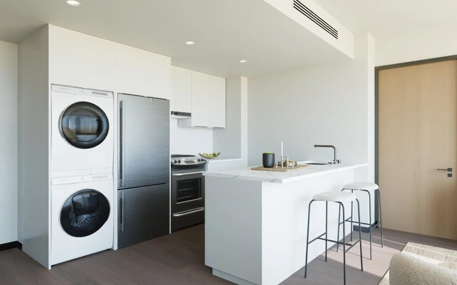 Contemporary Harlem apartment kitchen at The Forten with white cabinetry, in-unit washer & dryer, stainless steel appliances, and breakfast bar seating – ideal for Columbia University students and professionals.
