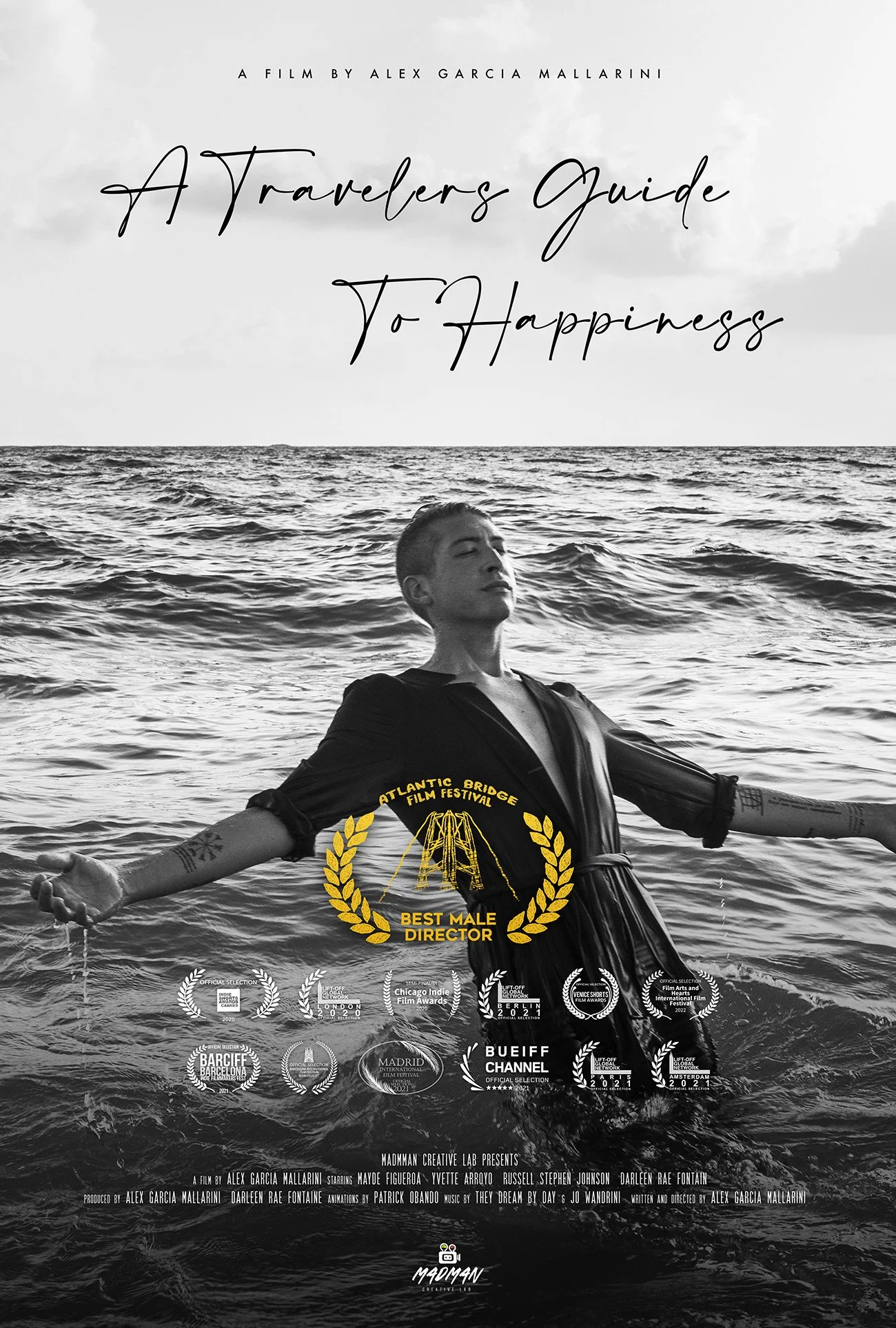Black and white poster for a film titled 'A Traveler's Guide to Happiness'. It features a woman with short hair standing in the ocean, arms outstretched, wearing a dark robe. The poster includes various film festival laurels and awards, with a prominent yellow emblem for the Atlantic Bridge Film Festival and awards for Best Male Director.