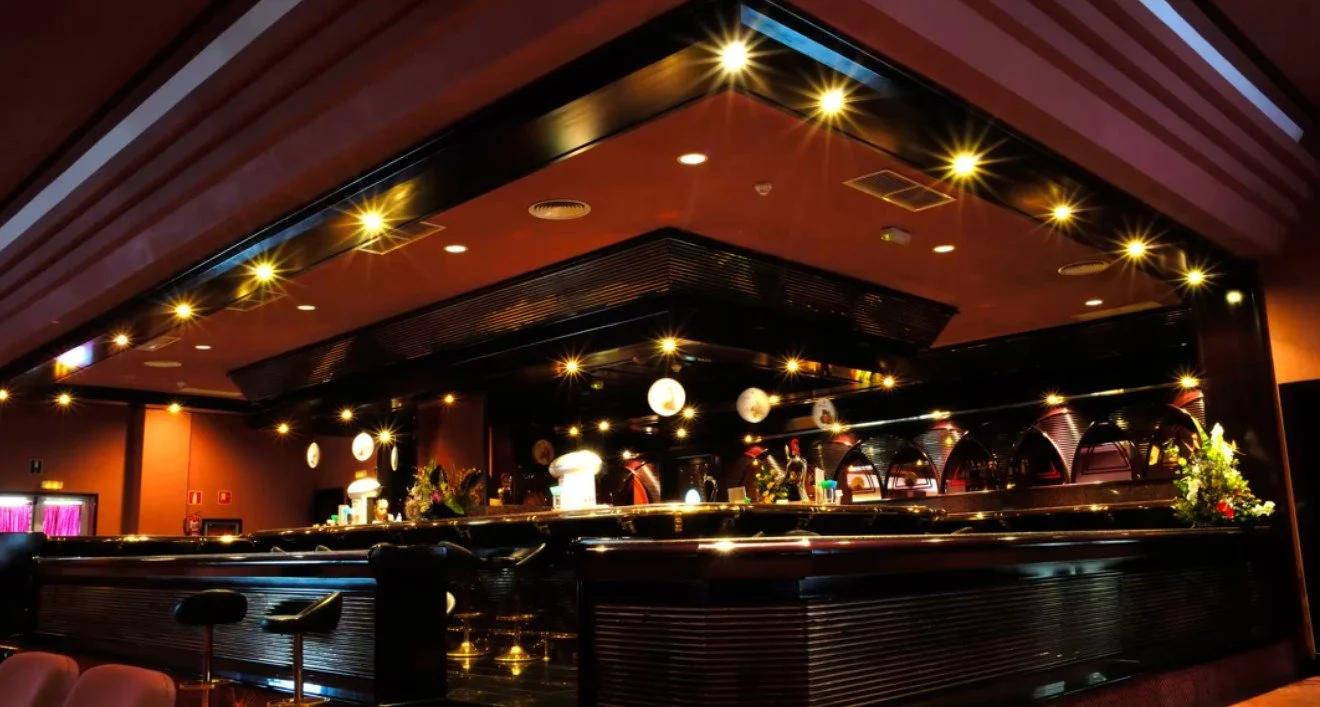 Warmly lit hospitality venue and bar ready for an event