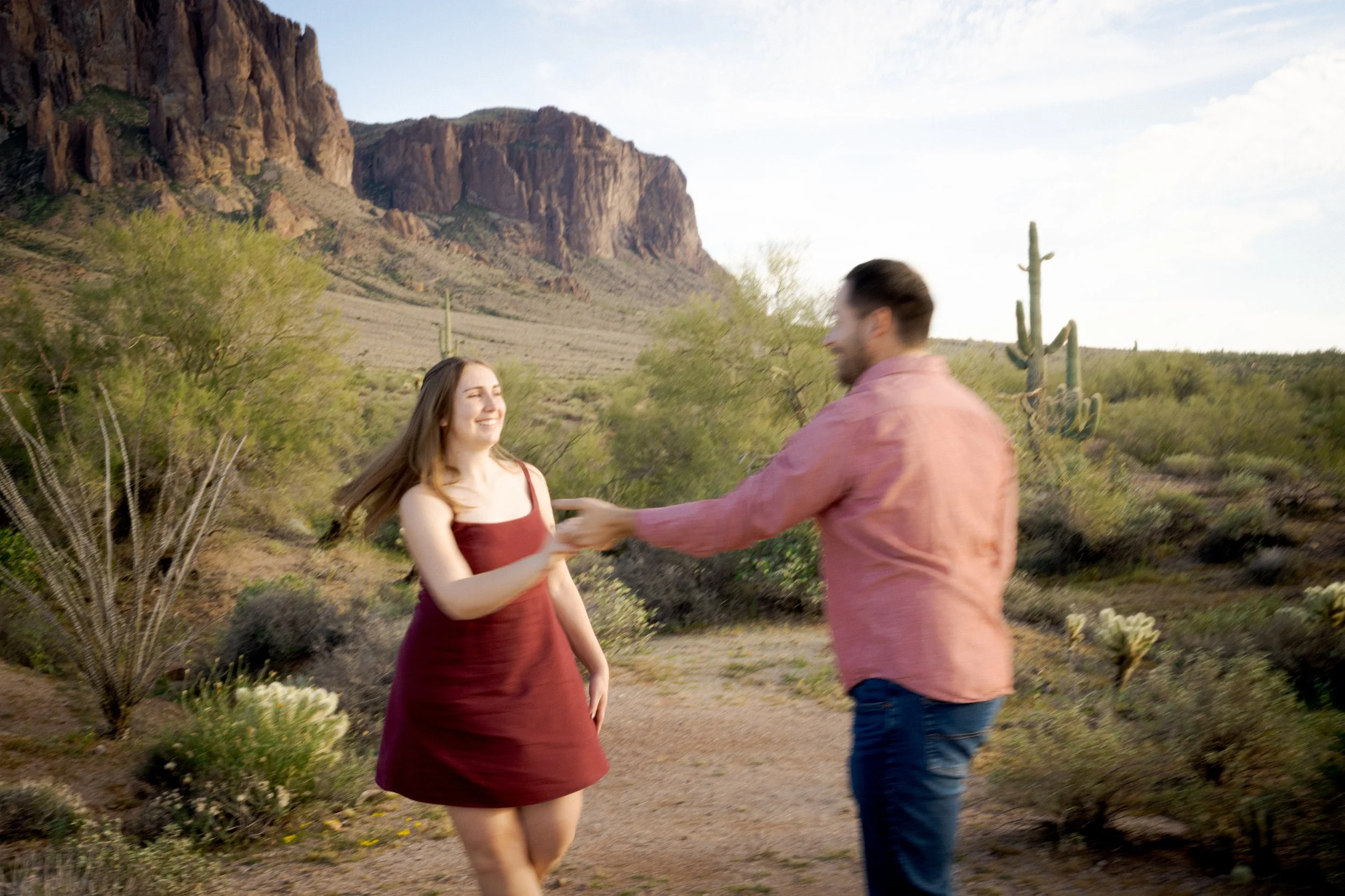 Engagement session on film at Lost Dutchman State Park, Arizona with desert light and Superstition Mountain views
