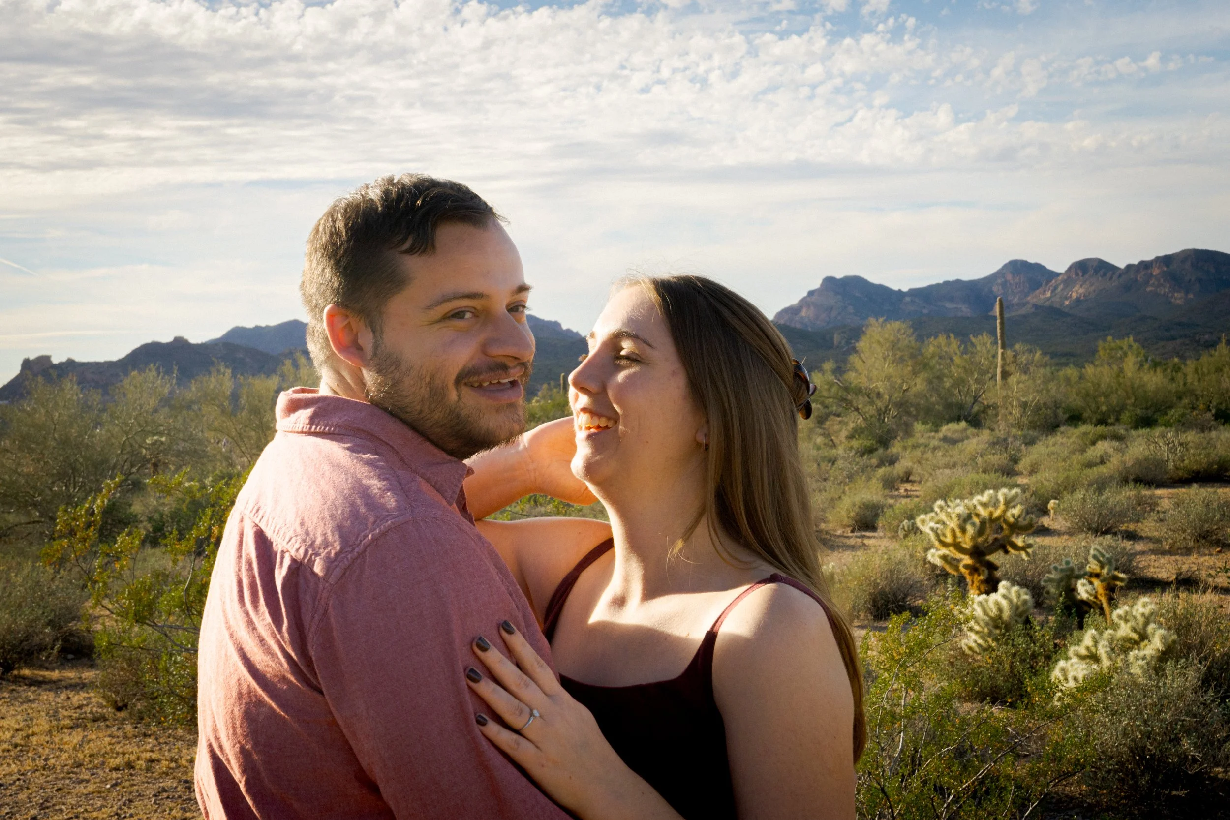 Engagement session on film at Lost Dutchman State Park, Arizona with desert light and Superstition Mountain views