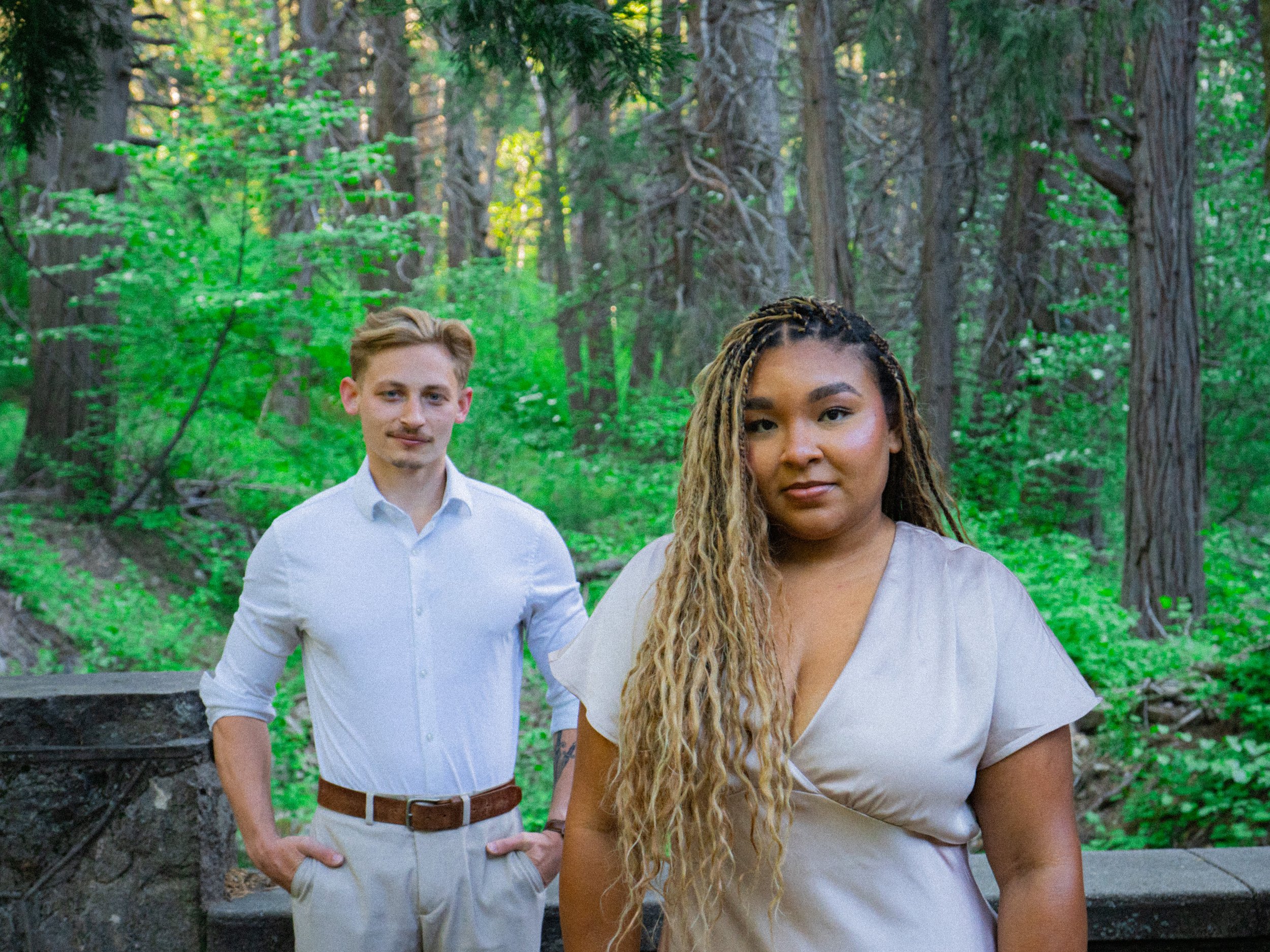 Lake Arrowhead Engagement photographer A couple stands in a forest.
