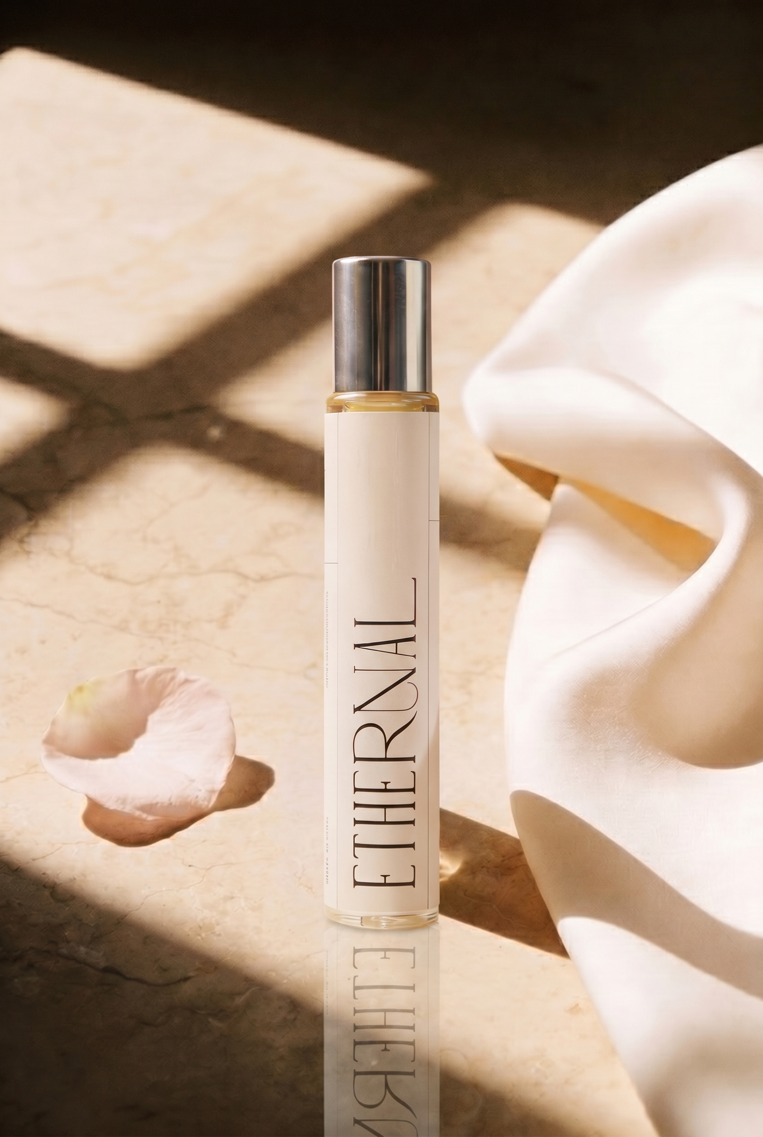ETHERNAL Perfume Oil 10 ml roll on on marble with a Damask rose petal
