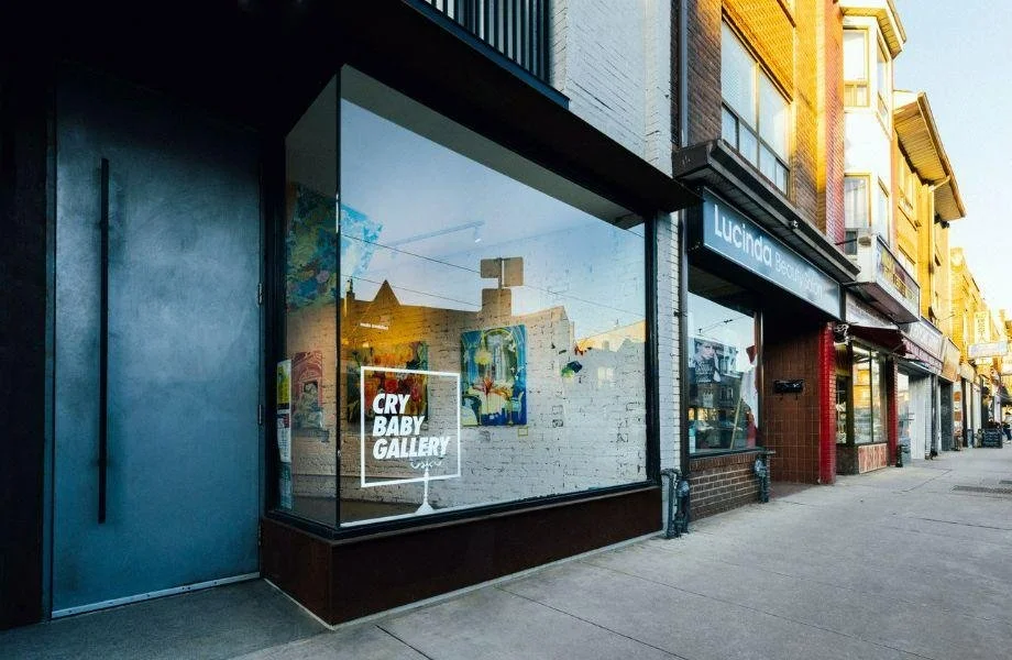 Exterior storefront window of Cry Baby Gallery on Dundas Street West in Toronto