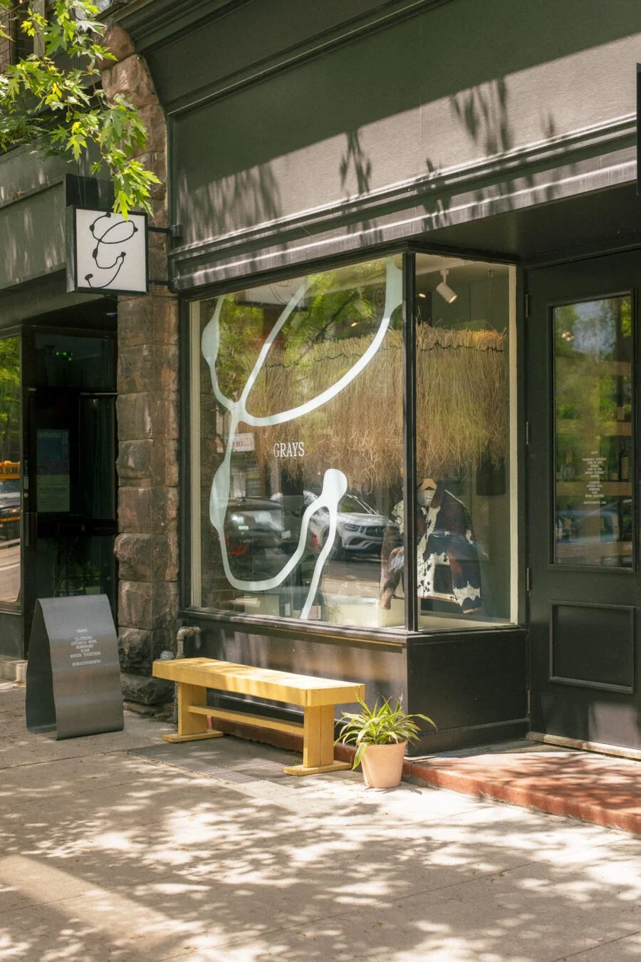Exterior storefront and signage of Grays clothing shop on Dundas Street West in Toronto