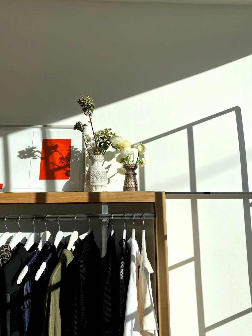 Designer clothing rack and storefront interior at VSP Consignment on Dundas Street West in Toronto