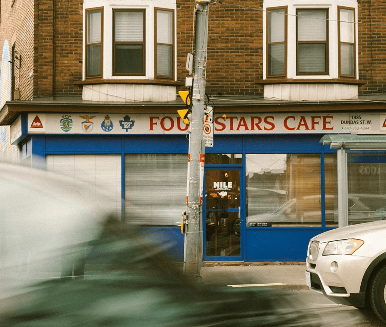 Exterior storefront of Nile Coffee Club on Dundas Street West in Toronto