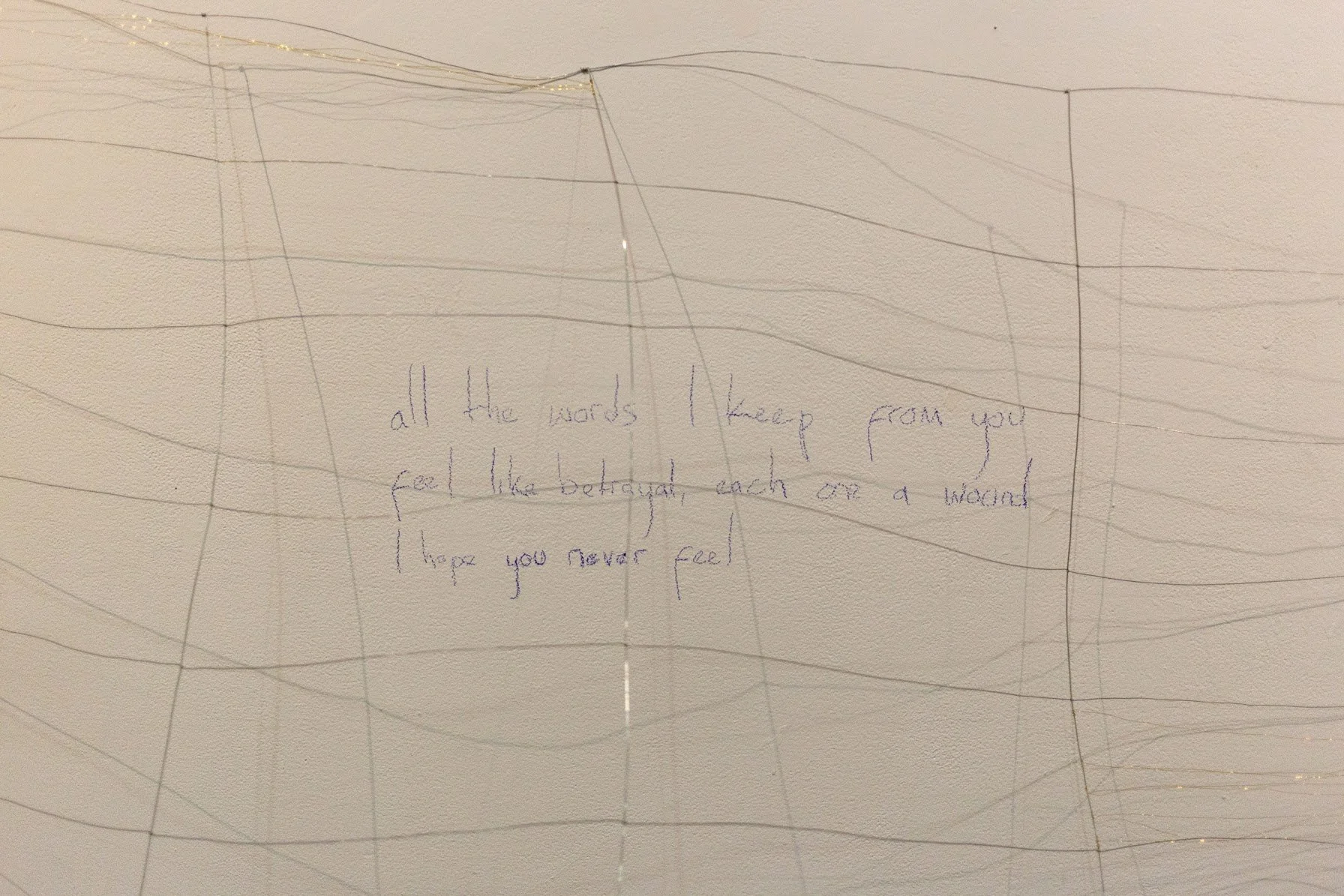 Brass and steel wire, colored pencil on wall