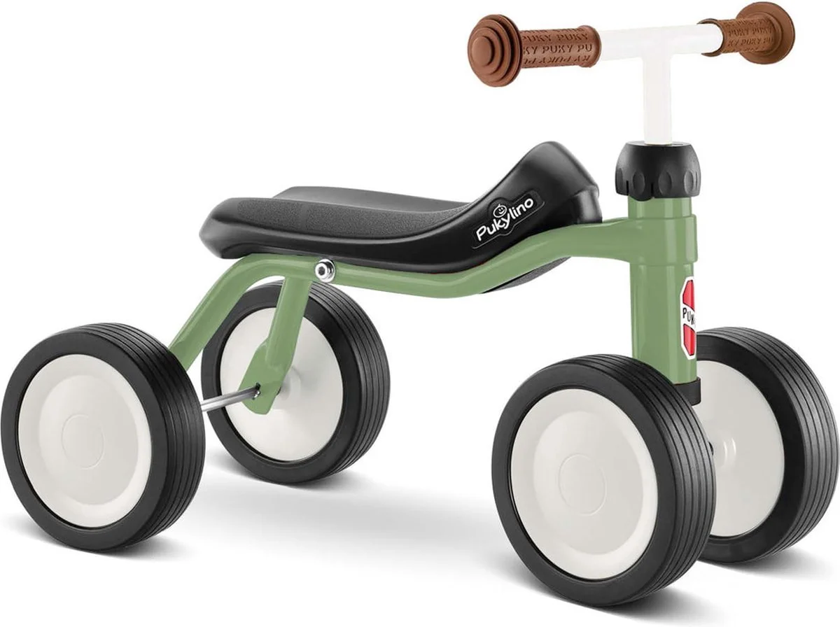 Een groene kinder fiets vanaf 1 jaar