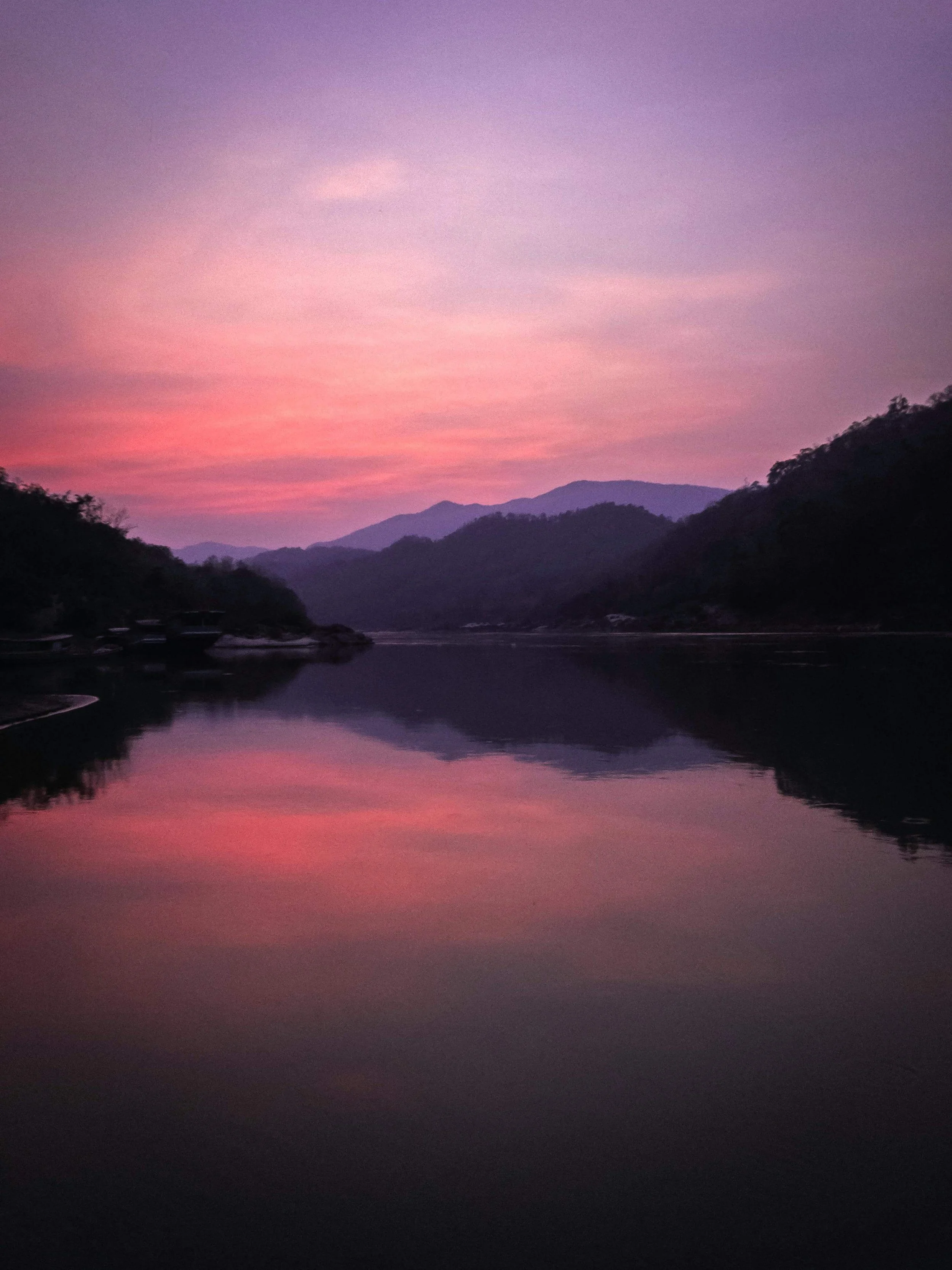 A serene mountain lake reflects a sunset. What does it take to repair a relationship after conflict leaves both partners feeling hurt & unheard? A relationship therapist in Davie, FL, explains why reconnection matters more than being right.