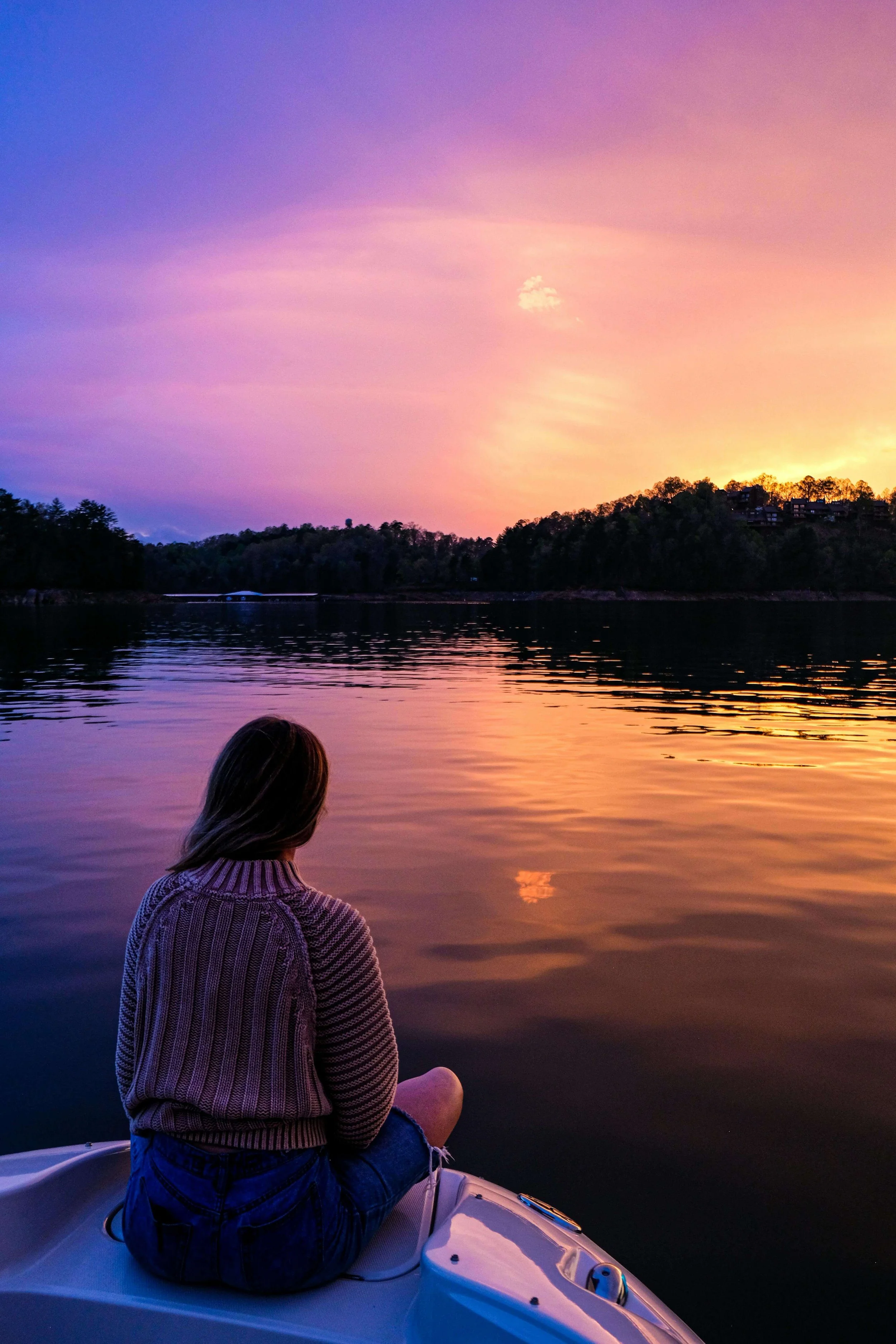 A woman sits on a boat gazing across a lake. What happens to a relationship when repair after conflict is consistently ignored or avoided? Relationship therapy in Davie, FL, offers tools to help couples rebuild trust and emotional safety together.