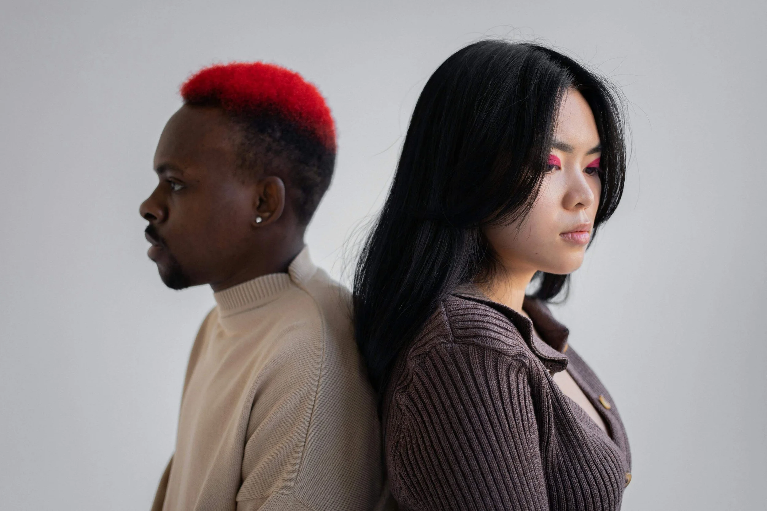 A serious man and woman stand back-to-back. Do you want to learn how to fix a relationship with poor communication? Learn healthier ways of expressing yourself through relationship therapy in Davie, FL.