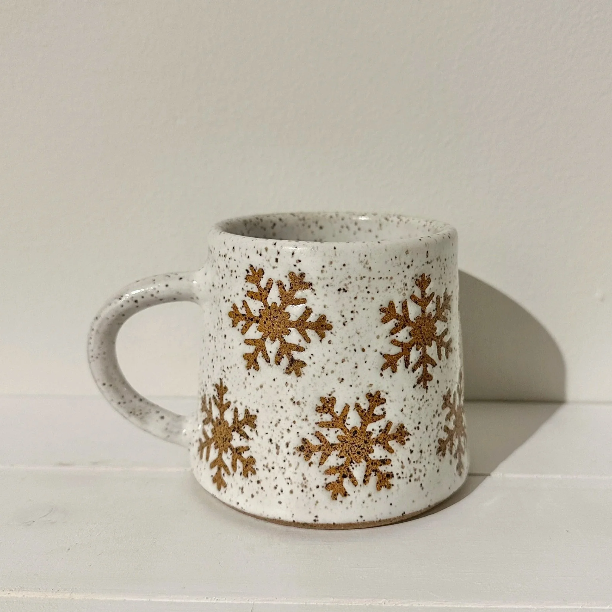 White Snowflake Mug (on Speckled Tan)