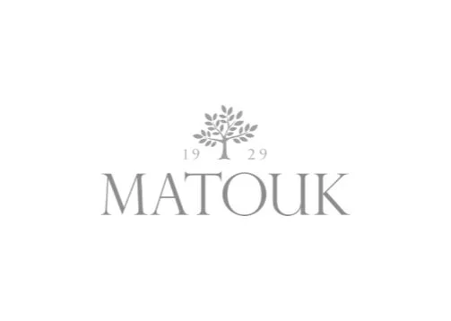 Logo featuring a tree above the text "MATOUK" with the year 1929 on either side of the tree