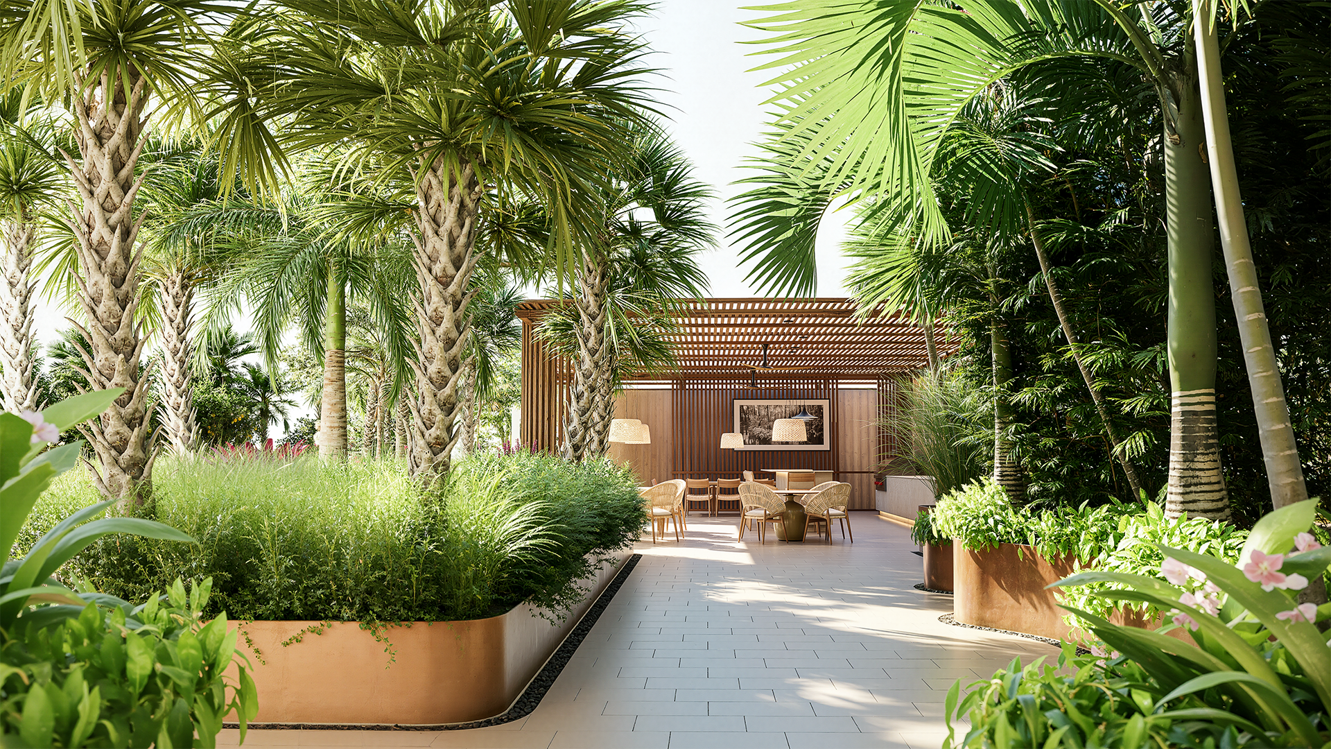 3D visualization of an outdoor amenity deck seating area surrounded by lush tropical plants and trees with a wooden pergola structure in the background.