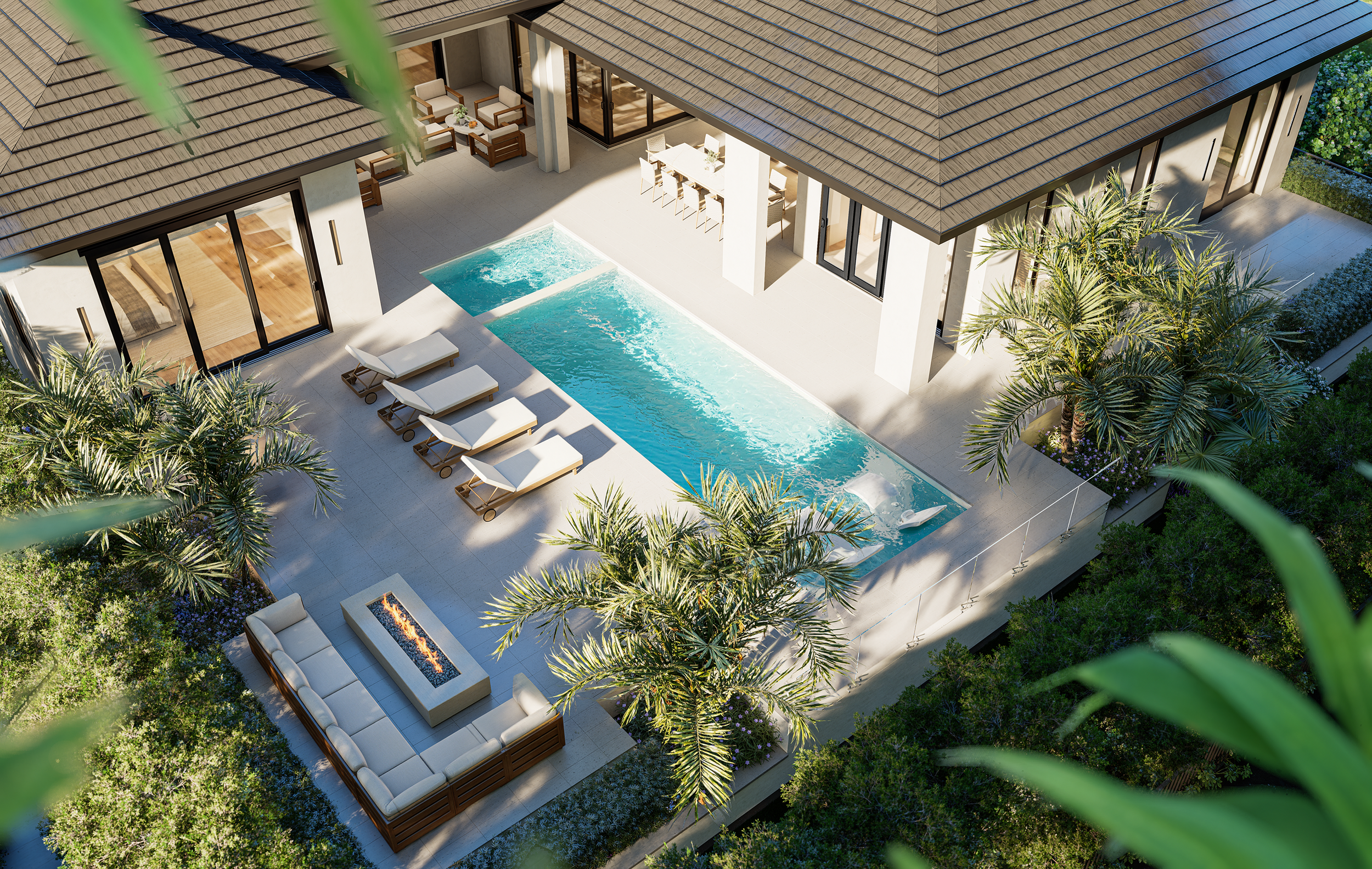 Aerial view of a modern backyard with a rectangular infinity pool, patio furniture including lounge chairs and a fire pit seating area, surrounded by lush palm trees and greenery, and a house with large glass doors and windows.