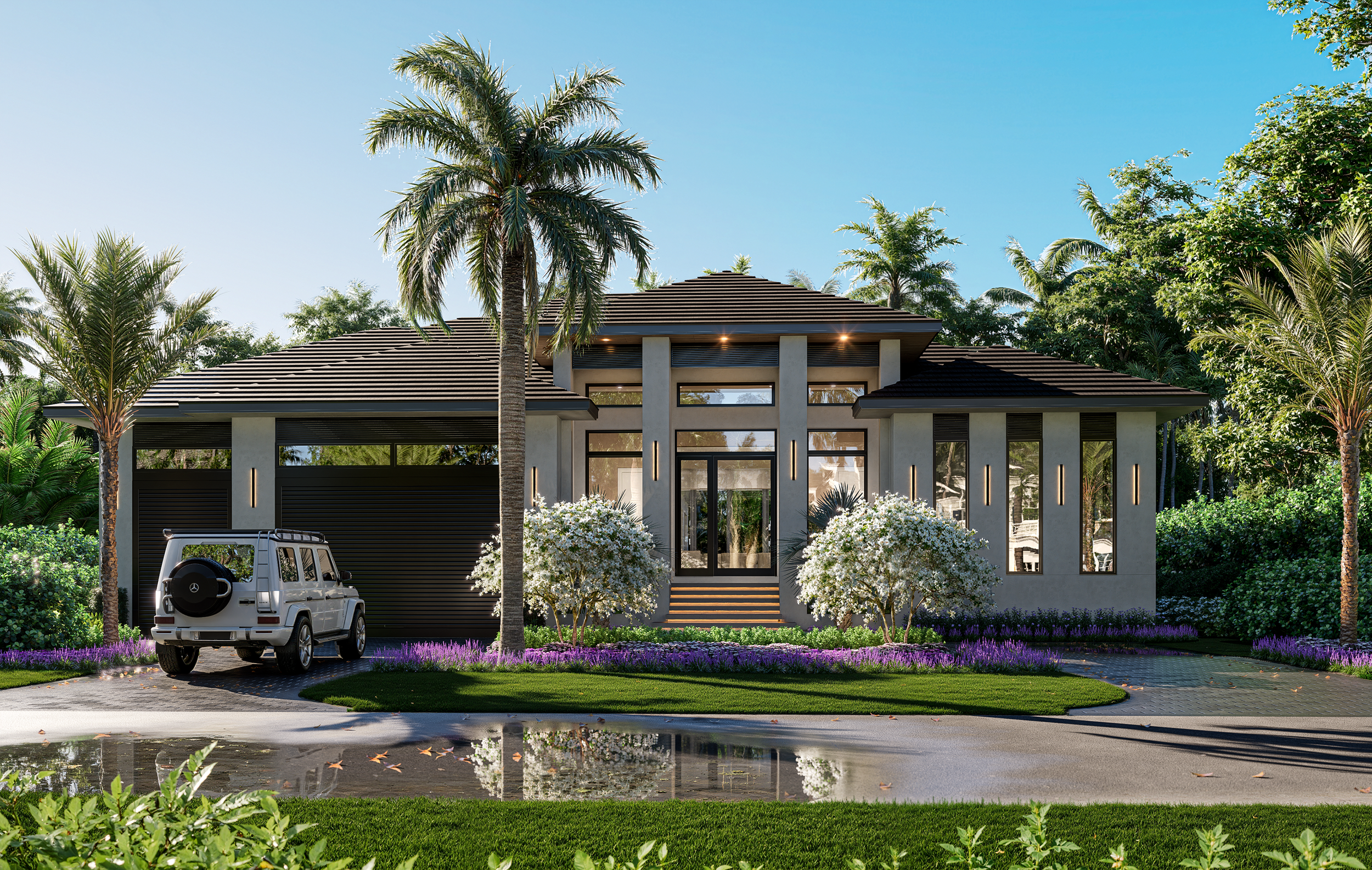 Modern house with palm trees, white flowering bushes, purple flowers, and a driveway with a white car in front under a clear blue sky.