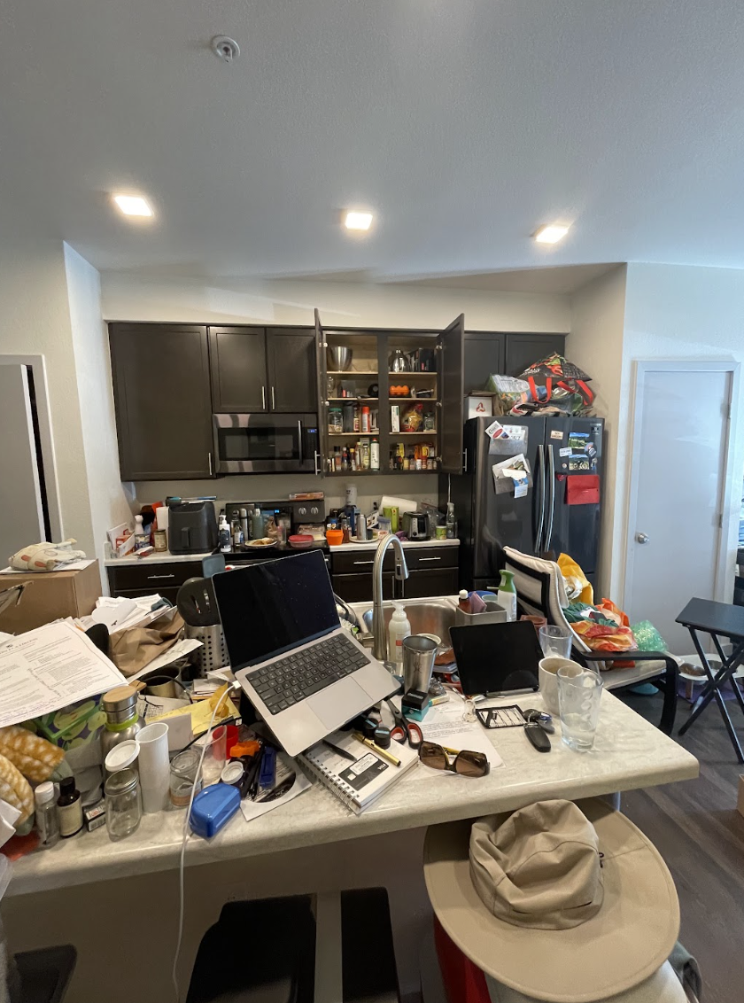 cluttered and messy kitchen and counter
