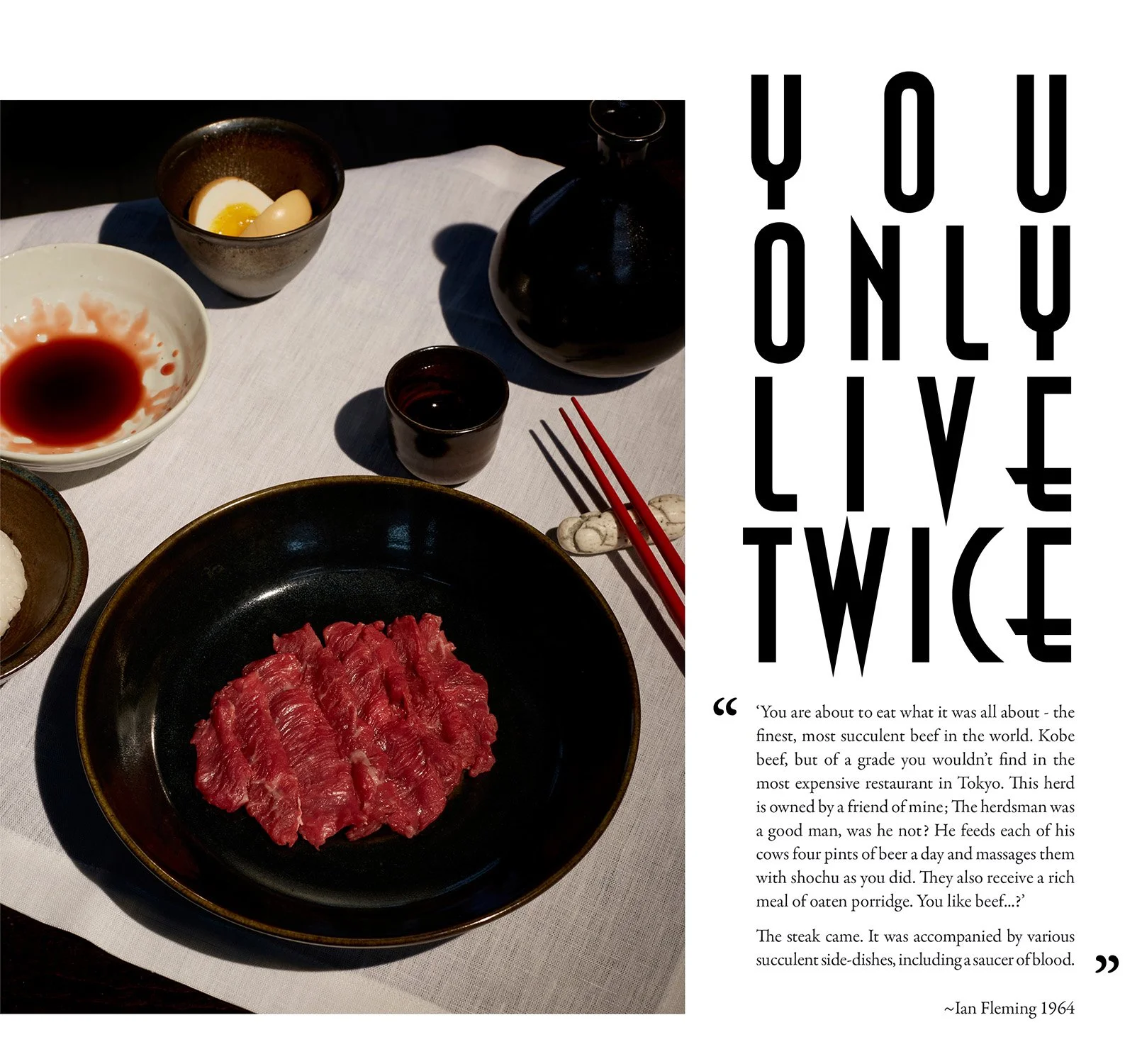 A table setting with a black bowl of raw beef slices, a small bowl of sauce, a bowl with sliced boiled eggs, a black pot, a cup, chopsticks, and text saying 'You Only Live Twice,' alongside a quote from Ian Fleming in 1964 about fine Kobe beef.