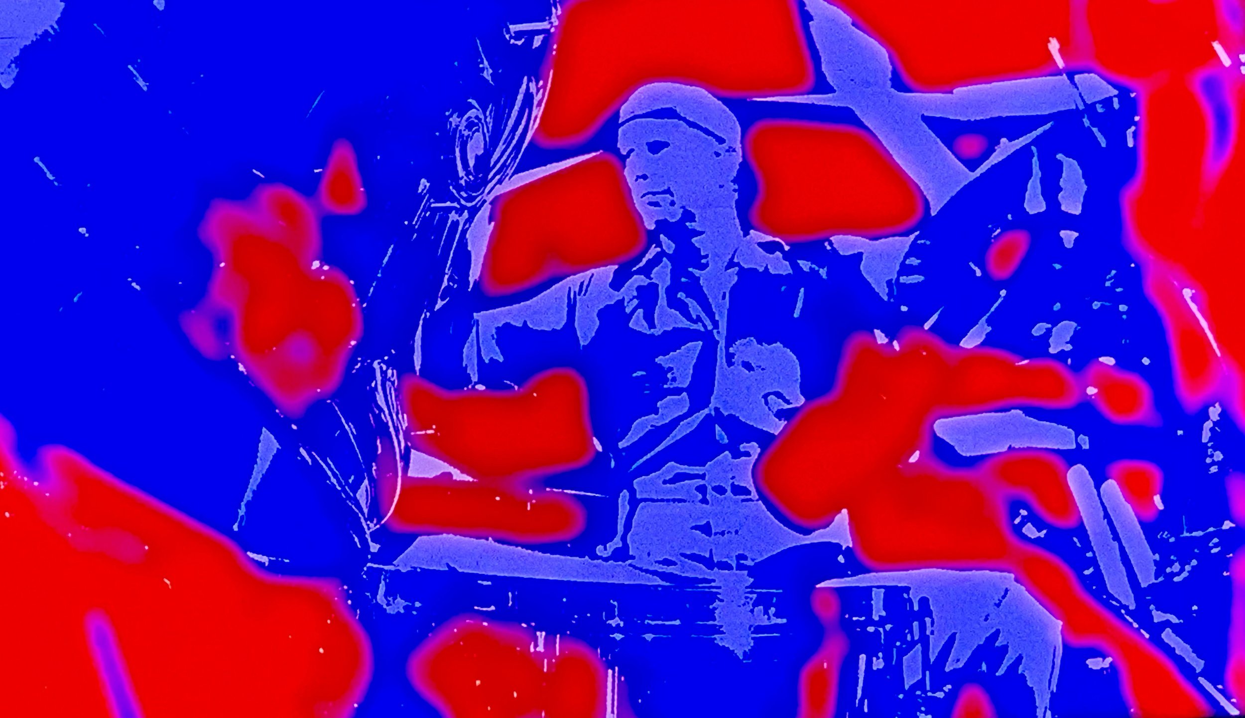 Colorful, stylized image of a drummer playing drums, with vibrant red, blue, and purple hues, and abstract effects.