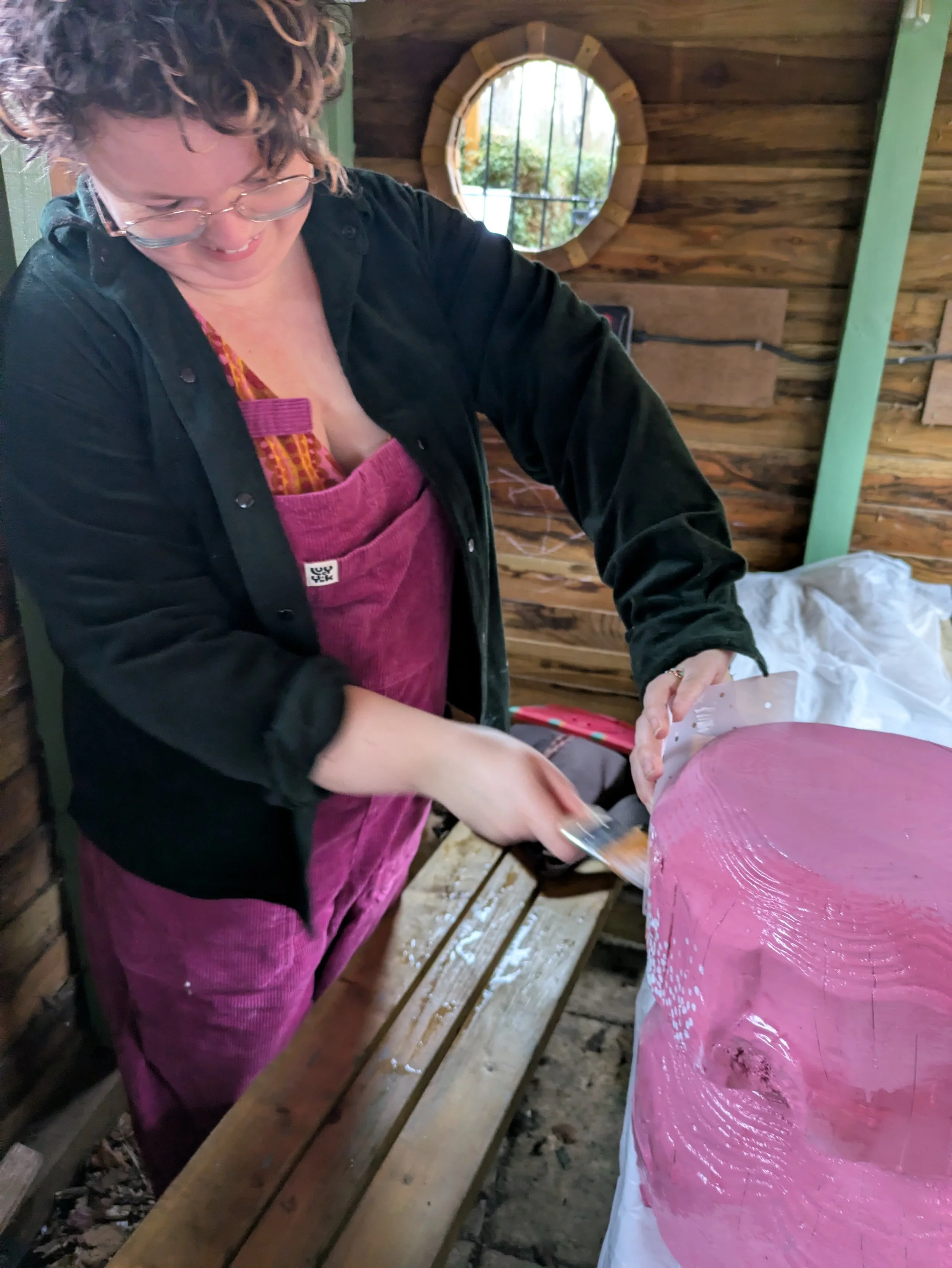 Molly starts painting on her mushroom