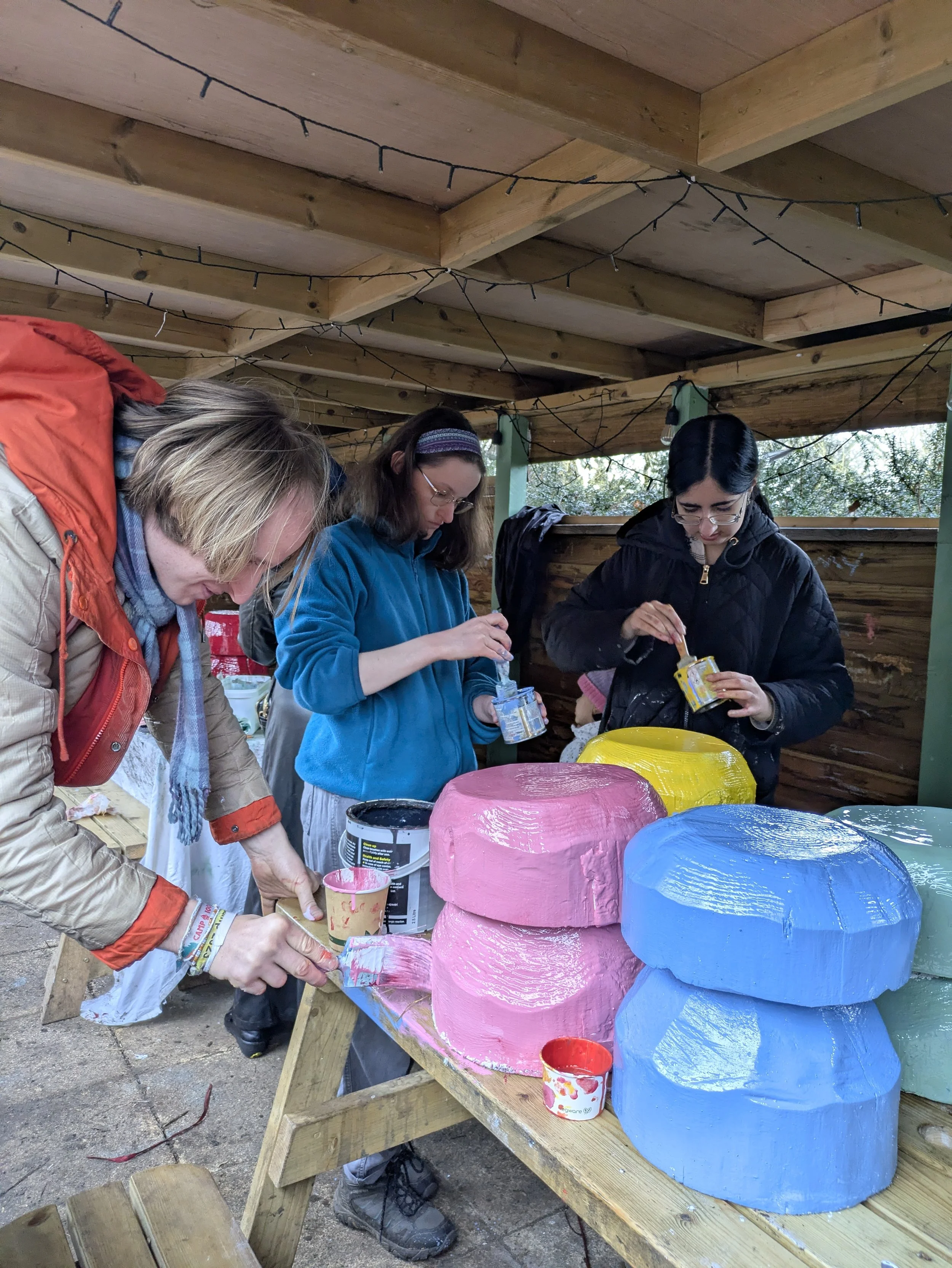 Tom lucy and Aysha paint base layers on their mushrooms 