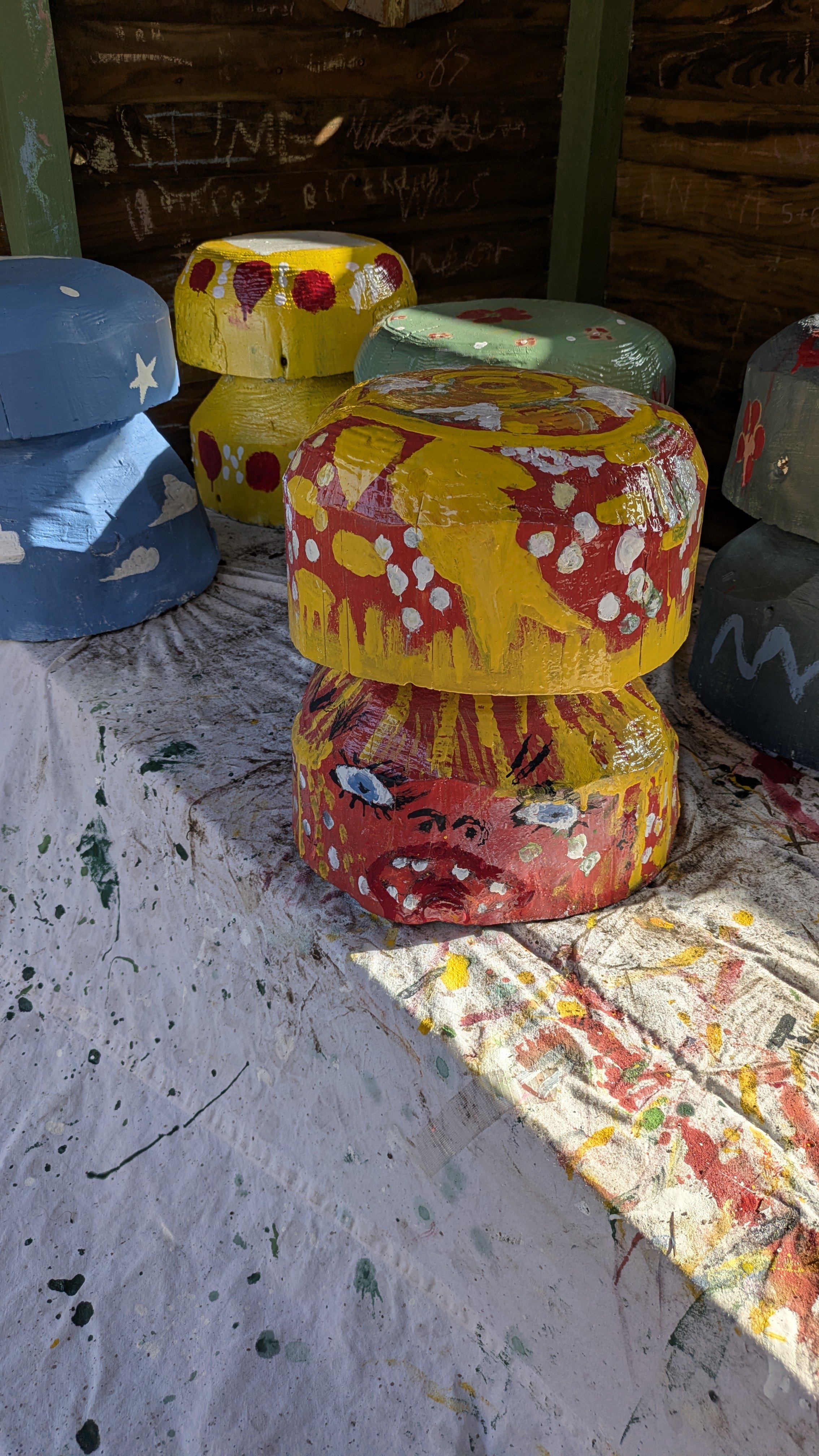 Toms mushroom with a face and red and yellow abstract pattern