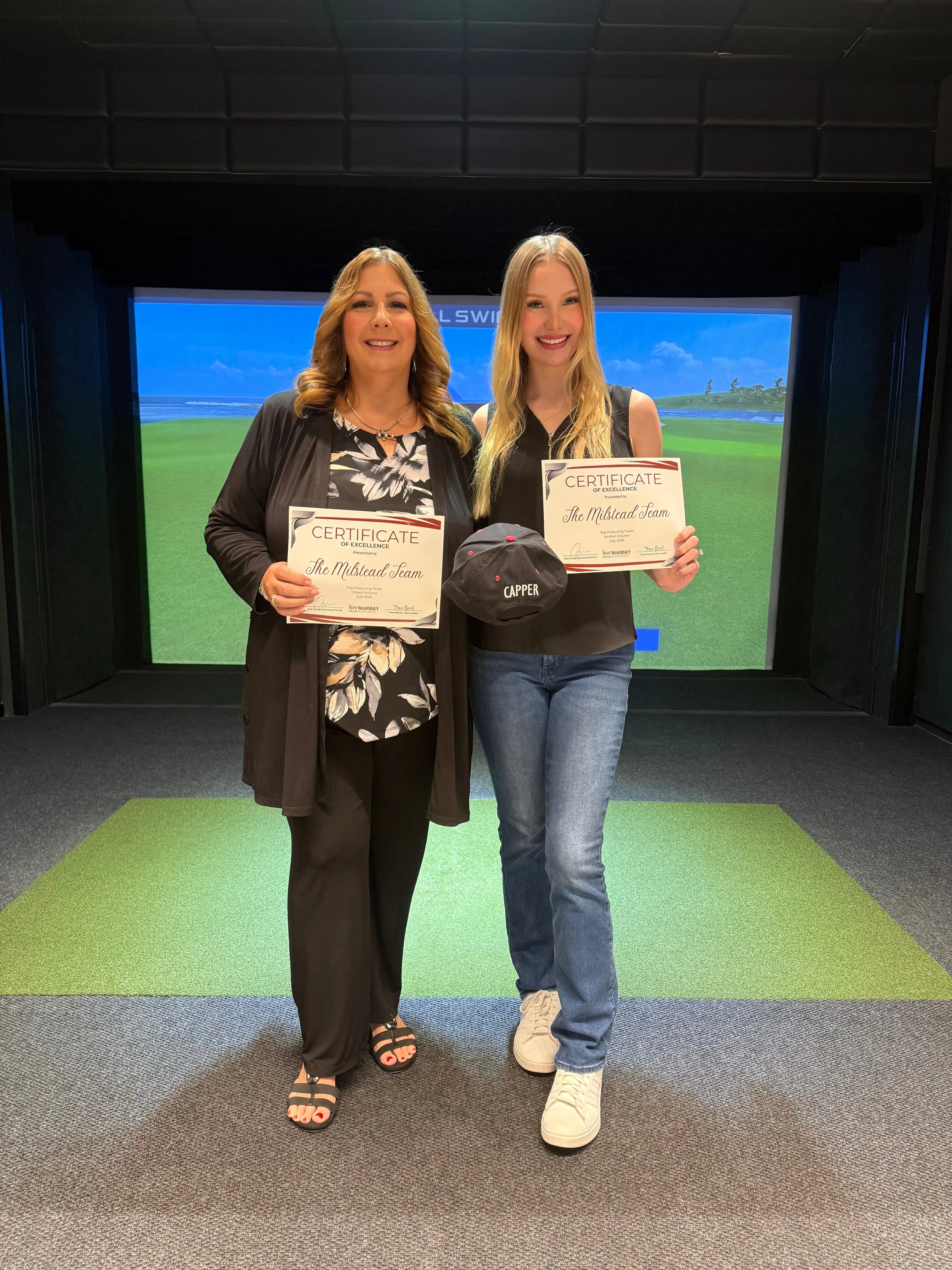 realtors in mckinney on the milstead team texas holding their awards for their real estate performance in the north texas market