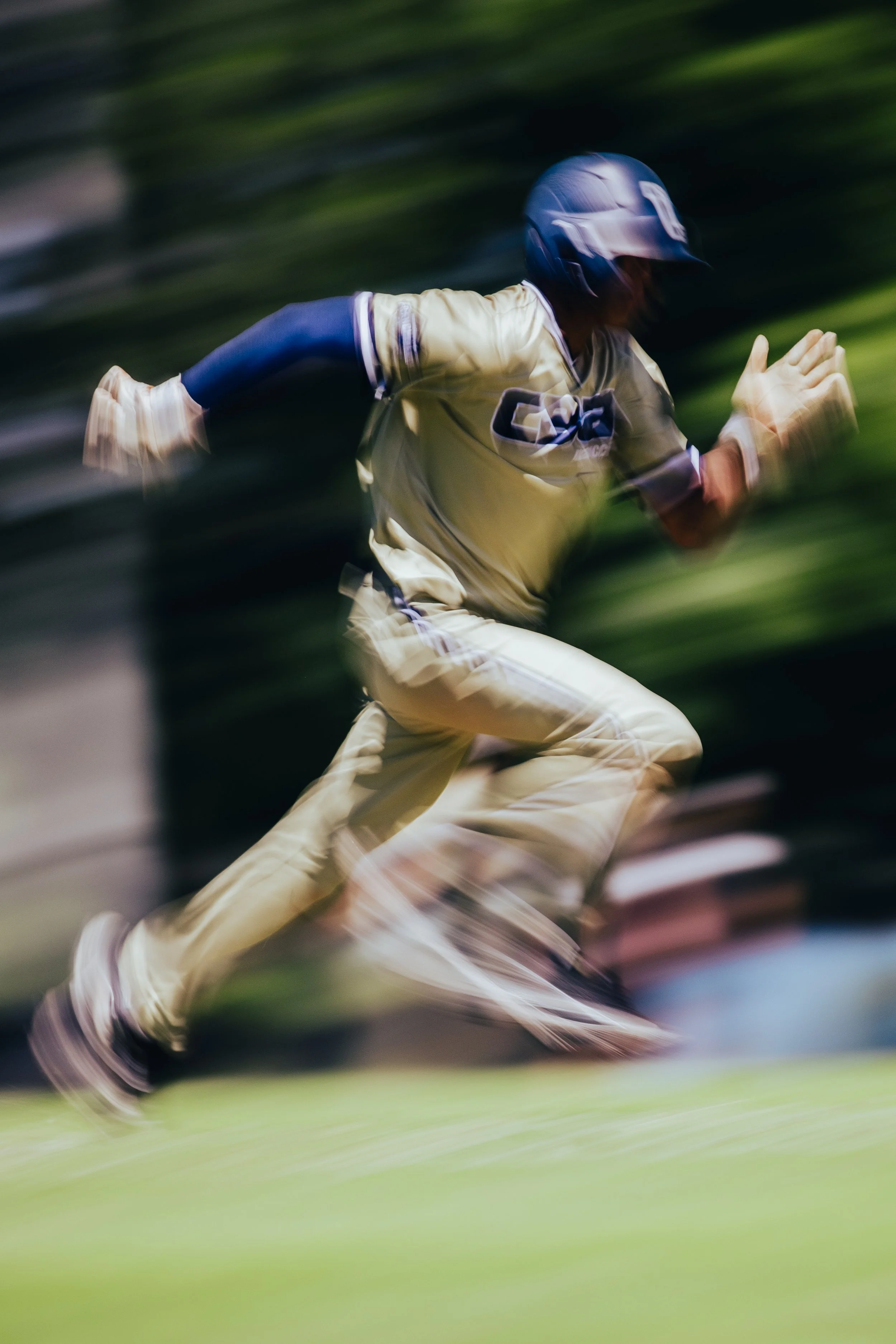 A person in athletic clothing running quickly, with motion blur creating a sense of speed.