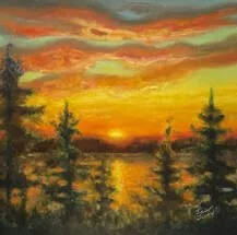A vibrant sunset over a lake surrounded by pine trees.