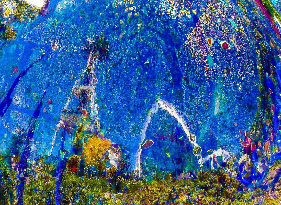 Abstract, colorful, and distorted image resembling a face with blue, green, yellow, pink, and purple hues.