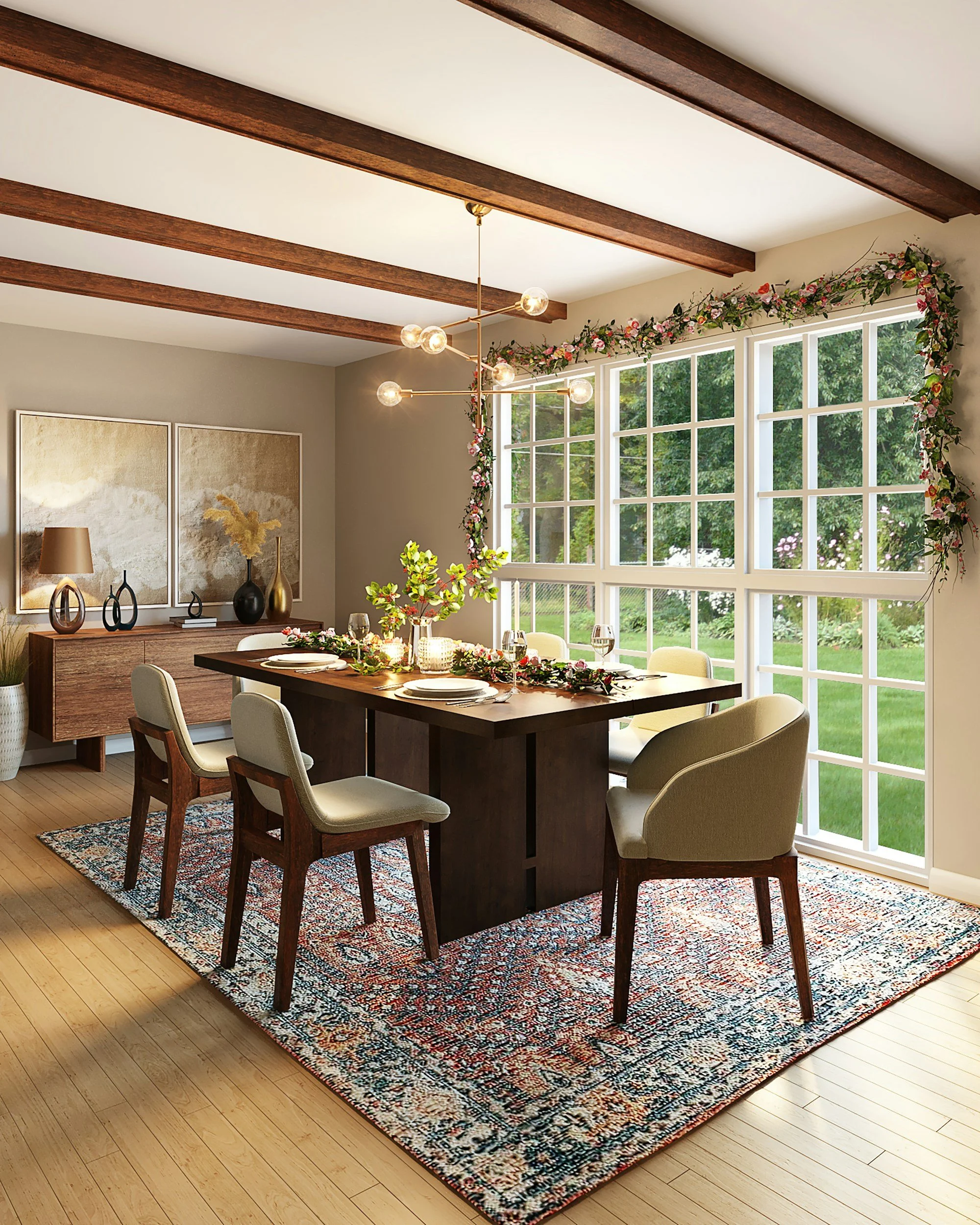 Modern dining room with wooden table, six chairs, and a decorative rug. Large windows provide outdoor view, framed with floral garland. Ceiling has exposed beams and a modern chandelier. Sideboard adorned with vases and artwork.
