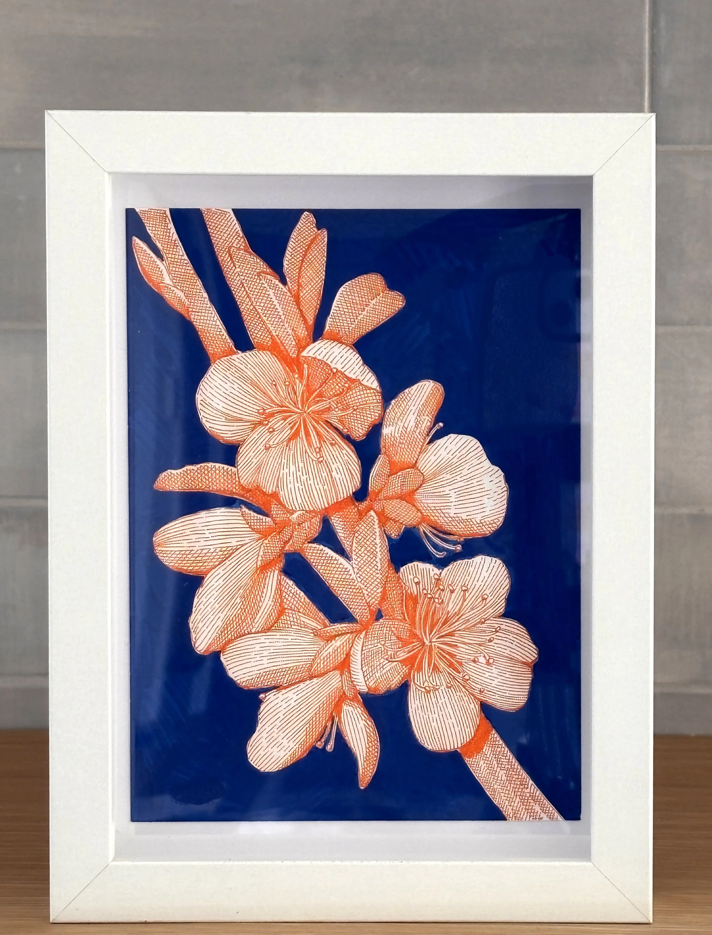 Orange line drawing of cherry blossoms on a blue background