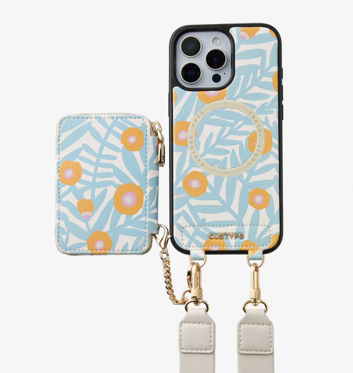 A light blue floral-patterned phone case with a ring holder, attached to a strap, alongside a matching cardholder, both with yellow and pink flowers.