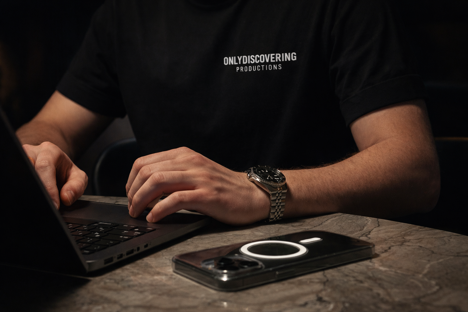 man taking notes laptop for branding stragegy and photography services